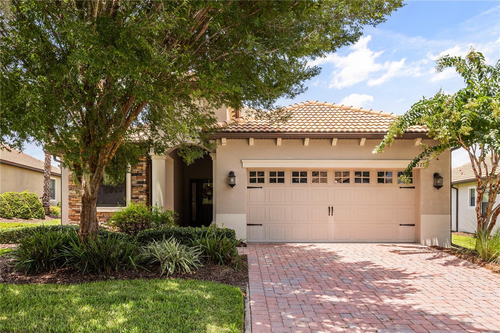 This 4-BEDROOM, 2-BATHROOM home features a captivating panorama of lush greens where PRIME GOLF COURSE FRONTAGE offers uninterrupted VIEW OF BOTH the challenging 10th TEE and the signature 18th HOLE GREEN. The meticulously updated residence in the highly coveted phase 1 of the Champions Gate Country Club is situated close by the Plaza clubhouse and restaurant. This residence offers unparalleled lifestyle of elegance and ease inside a premier gated community.
Step inside to discover a home where contemporary sophistication meets timeless comfort. The OPEN FLOOR plan creates an inviting atmosphere perfect for both intimate gatherings and grand entertaining. Culinary enthusiasts will delight with REMOLDED KITHCHEN ample space to inspire your next masterpiece. Both the kitchen and bathrooms have been refreshed with modern luxury including cabinetry and quartz countertops. 
Experience truly sustainable living with significant energy savings thanks to recent upgrades including Carrier AC system in November 2024, new windows July 2026 and valuable transferable solar panels. 
The expansive PRIMARY SUITE is a true sanctuary featuring private sliding door access directly onto the lanai, TWO GENEROUS WALK-IN CLOSETS, luxurious GARDEN TUB, and an oversized WALK-IN SHOWER creating a SPA INSPIRED RETREAT.
A thoughtfully designed split floor plan ensures optimal privacy providing secluded spaces for residents or guests. Fourth bedroom easily used for OFFICE or FLEX SPACE with ample walk-in closet for additional storage. 
Seamlessly transition to your PANPRAMIC SCREENED LANAI, the perfect vantage point to enjoy the dynamic golf course activity, rocket launches, fireworks, and breathtaking FLORIDA SUNRISES. This home isn't just a residence; it's a getaway to the amenities and vibrant community spirit of Champions Gate. HOA fee covers your access to THE OASIS CLUB: Clubhouse with restaurant, movie theater, fitness center, game room, tiki bar, lazy river and cabanas and more. THE PLAZA: A resident only clubhouse with restaurant, bar, fitness center, two pools and spa. THE RETREAT CLUB: Featuring a full waterpark, mini golf, and restaurant. HOA benefits include FULL GOLF AND TENNIS MEMBERSHIP, access to all the club amenities (Oasis Club, The Retreat Club, and The Plaza). Gated entry, full lawn care, cable, internet, and phone services, and trash. Golf cart friendly. ENJOY ALL THE NEARBY DISNEY THEME PARKS!