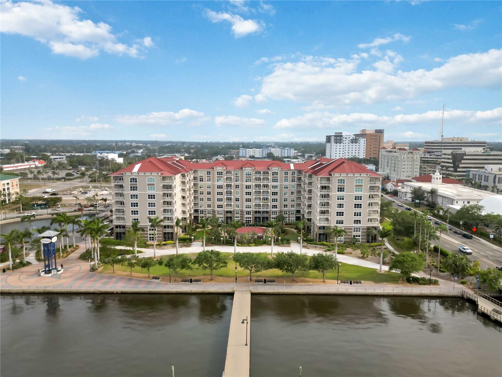 Welcome to River Dance, a premier waterfront community located along the scenic Manatee Riverwalk. This exceptional 3-bedroom, 2-bathroom condominium at River Dance offers two lanais with breathtaking direct views of the Manatee River both with hurricane proof sliding doors as well as a spacious open floor plan designed for modern living.

Interior Highlights include

Freshly Painted: As of January 2025, the interior has been updated with crisp white paint, providing a bright and contemporary ambiance.

Spacious Kitchen: Equipped with granite countertops, stainless steel appliances, ample cabinetry, and a walk-in pantry, the kitchen seamlessly overlooks the light-filled living and dining areas.

Primary Suite Retreat: Features a generous walk-in closet and an en-suite bathroom complete with a garden tub and walk-in shower.

Additional Bedrooms: This floor plan includes two additional bedrooms, one of which boasts a private patio. These rooms offer versatility for guests, a home office, or hobbies.

Community Amenities:

Residents of River Dance enjoy a suite of resort-style amenities:

Sports Facilities: Tennis and pickleball courts, a basketball court, and a six-hole practice putting green.

Recreation Areas: A community center with a kitchen and pool table, a movie/media room, and a game room.

Wellness Facilities: A fully equipped fitness center and a rooftop jogging track.

Outdoor Leisure: A heated swimming pool with jacuzzi, cabana, and grilling area.

Guest Accommodations: Two on-site guest suites available for visitors.

Parking: Two assigned, secure, gated, and covered parking spots for added convenience.

Prime Location:

Situated directly on the Riverwalk, this condo is a short stroll from the vibrant shops and restaurants of downtown Bradenton. The Anna Maria Island Ferry docks are conveniently located in front of the River Dance community, offering a scenic boat ride to the beautiful beaches without the hassle of parking. Additionally, the pristine shores of Anna Maria Island are just a short drive away.

This rare 3-bedroom condo at River Dance presents an outstanding opportunity for year-round living or a seasonal retreat. Schedule your private tour today and experience luxury waterfront living at its finest!