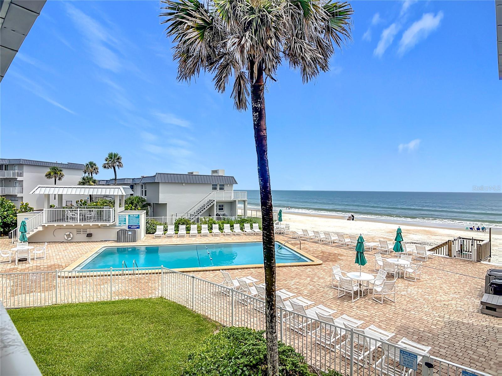 Escape to coastal bliss in this stunning oceanfront townhouse-style condo, located on the no-drive beach. This beach home boasts of breathtaking views of the Atlantic Ocean. Enjoy coastal decor throughout. Lowest monthly HOA on beachside at only $578 per month. This beach home features a beautifully renovated kitchen and living area, blending modern with seaside serenity. Enjoy captivating ocean views from the master bedroom, making this condo the perfect retreat for those seeking a peaceful beach lifestyle. This property offers an in-unit laundry facility and renovated bathrooms. Short term rentals and pets allowed.