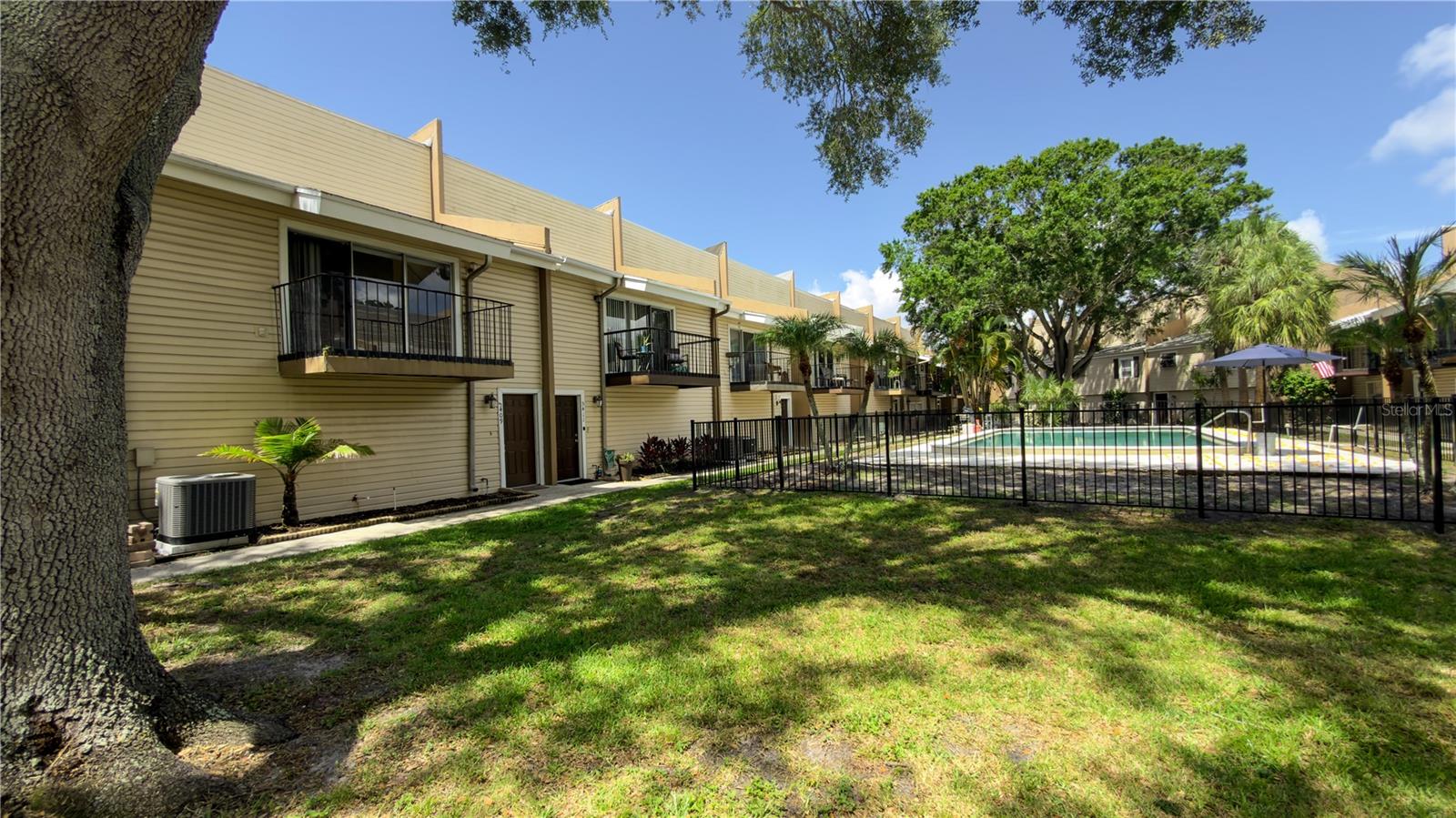 Welcome to low maintenance living in an unbeatable location! This beautifully updated 3 bedroom, 2 bathroom townhome with a 2 car garage offers a spacious and versatile floor plan designed for both comfort and style. Inside to find luxury vinyl flooring, soaring ceilings, and abundant natural light throughout. The recently remodeled kitchen is the heart of the home, featuring newer cabinetry, quartz countertops, a large center island, garden window, and a spacious eat in dining area perfect for everyday living and entertaining. The second floor showcases an open concept living area with direct access to a private balcony overlooking the community pool and park area, creating the perfect spot to enjoy your morning coffee or unwind after a long day. A full bathroom on the second floor adds convenience for guests. The flexible floor plan includes a private bedroom on the first floor, ideal for guests, a home office, or multigenerational living. The third floor features two additional bedrooms, including a spacious primary suite with a walk in closet and direct access to the updated bathroom. Both full bathrooms have been recently remodeled with modern finishes. Additional highlights include a newer AC system, updated finishes throughout, and a highly desirable location minutes from the golf course, shopping, dining, entertainment, major roadways, the airport, and everyday conveniences. This move in ready townhome combines modern updates, functional living space, and a prime location.