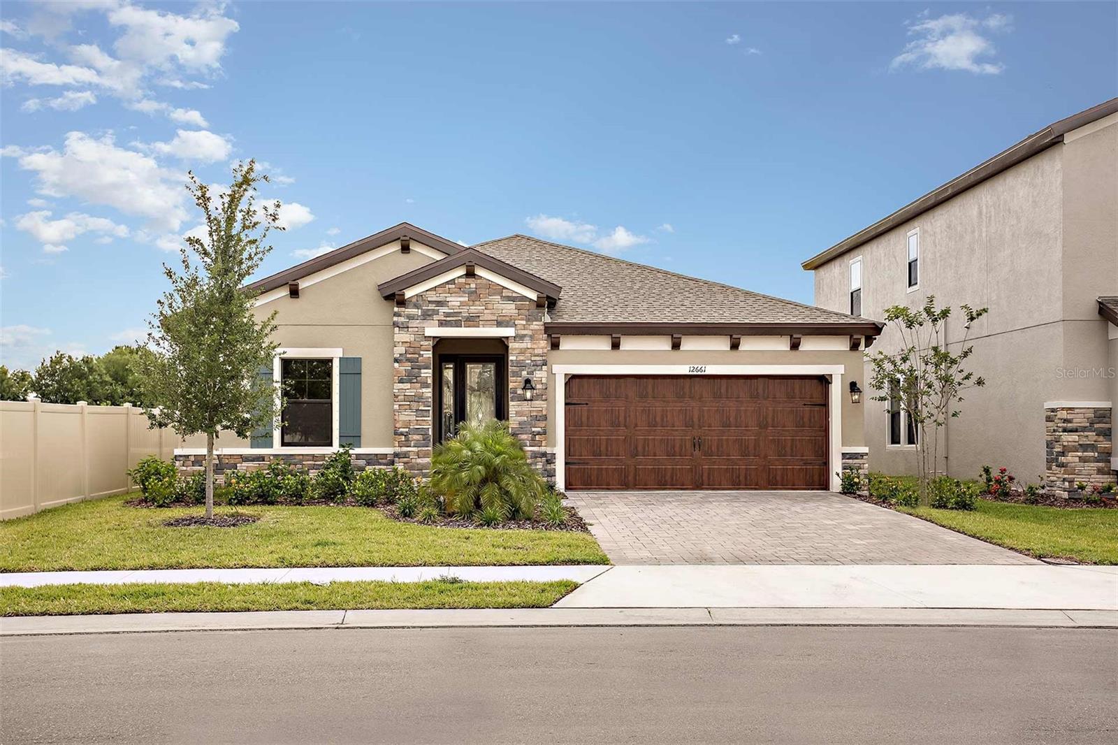 For a limited time, Homes by WestBay is offering $30,000 towards buyer’s closing costs, pre-paids, rate buydowns, or off the price of this home. Promotion amount is specific to this home only.
This Sandpiper Quick Move-In home is READY NOW! This home features our "Modern Farmhouse" Design Collection interior: Sonoma Stone cabinets, Ethereal Wht. Quartz counter-tops, Floorte Resolute Plus Silo Pine LVP flooring, and more. The Sandpiper floorplan offers stylish, open plan living, abundant natural light and a covered lanai to extend the living areas outside. The gracious foyer gives access to the spacious first bedroom and den space in the front of the home. Further, the foyer opens to the heart of the home with its island kitchen overlooking the semi-formal dining and grand room. Secluded off the grand room is the luxurious owner’s retreat with oversized double walk-in closets. The exceptional layout of the owner's bath comes with a large walk-in shower. Completing the Sandpiper is a private, generously-sized third bedroom, ideal for a guest room or home office.

Hawkstone is a master-planned community located in Lithia, FL. Residents enjoy the best of both worlds with resort-style amenities while staying close to top-rated Lithia schools, nature preserves, family-friendly activities, US-301, and I-75. Enjoy the pet-friendly hiking trails at the 969-acre Triple Creek Nature Preserve, less than 2 miles south or try your hand at bicycle motocross at Triple Creek BMX, 1 mile south of Hawkstone.

Exterior image shown for illustrative purposes only and may differ from actual home.
Completion date subject to change.