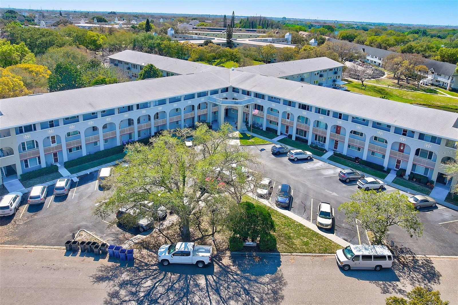Updated and spacious "GRANDE" model offering 1,725 sq. ft. in Casa Verde, located within the highly desirable 55+ golf community of On Top of the World in Clearwater. This move-in ready 2-bedroom, 2-bath condominium features a bright and airy interior with hurricane-impact windows (2017), fresh paint, and a large living and dining area perfect for entertaining.

The open kitchen is beautifully updated with quartz countertops, GE stainless steel appliances including a double oven, glass tile backsplash, and a charming bay window. The laundry room includes a GE washer and dryer along with custom cabinetry for added storage and convenience.

Additional features include laminate flooring throughout, walk-in closets in both bedrooms, a Trane A/C system (2014), and a Rheem water heater (2022).

Enjoy the exceptional lifestyle that On Top of the World offers, including two golf courses, two swimming pools with spas, fitness classes, numerous clubs, and an active social calendar. Association approval is required.