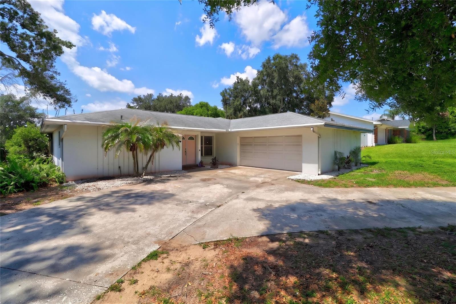Enjoy the best of Florida living in this inviting 3-bedroom, 2-bathroom home located in the established Lake Link Estates community of Winter Haven. Positioned on a corner lot, this property offers a thoughtful floor plan with generous living spaces and plenty of room to make yourself at home. The interior features an open feel with a seamless flow between the main living areas, while the primary bedroom provides a comfortable retreat complete with a walk-in closet and private en-suite bath. Large windows throughout the home allow natural light to fill the space, creating a bright and welcoming environment. Out back, you'll find a true highlight of the property—a screened outdoor living area overlooking a refreshing pool and fenced backyard. Whether you're hosting friends, spending time with family, or simply enjoying a quiet evening outdoors, this space is designed to be enjoyed year-round. Conveniently located near everyday amenities, restaurants, parks, and Winter Haven's famous Chain of Lakes, this home offers a wonderful opportunity to enjoy both comfort and convenience in one of Central Florida's most desirable areas.
