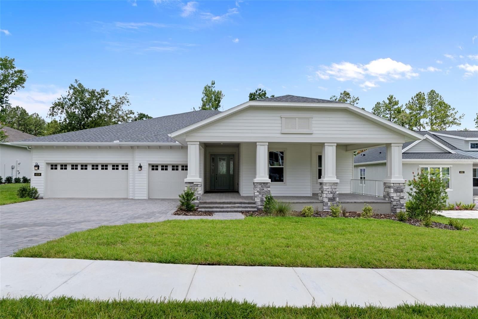 This magnificent semi-custom home was built by Spire Homes in the sought-after golf course community of Southern Hills Plantation. The Spire Homes' Dartmouth floor plan features 2,866 SF of beauty and elegance, starting with a lovely foyer entry, a massive great room with a tray ceiling, and a beautifully situated 20x11 den or flex room. There are four large bedrooms, three full baths, one long lanai with water and gas drops for an outdoor kitchen, and a three-car garage. 
The gourmet kitchen offers beautiful cabinetry with soft-close drawers, quartz countertops, subway backsplash, and a spacious island with pendant lighting, double sinks, and a five-burner gas cooktop. The primary bedroom suite is spacious and features a massive walk in closet with wood shelving. The primary en-suite bathroom showcases a free-standing tub, gorgeous shower, and dual sinks with quartz countertops. The beauty of 8' doors, 5.25" baseboards, Lifetime Warranty LVP flooring in the main areas, dual pane Low-E windows, and so much more runs throughout this amazing home! Four natural gas drops include a gas drop for the future lanai outdoor kitchen, the tankless water heater, the five-burner cooktop, and a gas (or electric) dryer. All this and more! 
Southern Hills Plantation is a premier golf course and lifestyle community. It features a manned and gated entrance and showcases a Pete Dye 18-hole Signature Golf Course where golf and outdoor living merge at their finest. The stunning topography offers some of the most beautiful and serene views to be found anywhere. Amenities include Har-Tru clay tennis courts, pickleball, a full-service fitness center, a swimming pool with an attached tiki bar-type cafe, a grand clubhouse, a pro shop, a driving range, a putting green, and both formal and informal restaurants. Don't miss this opportunity to own this fabulous home and live in a lifestyle paradise!