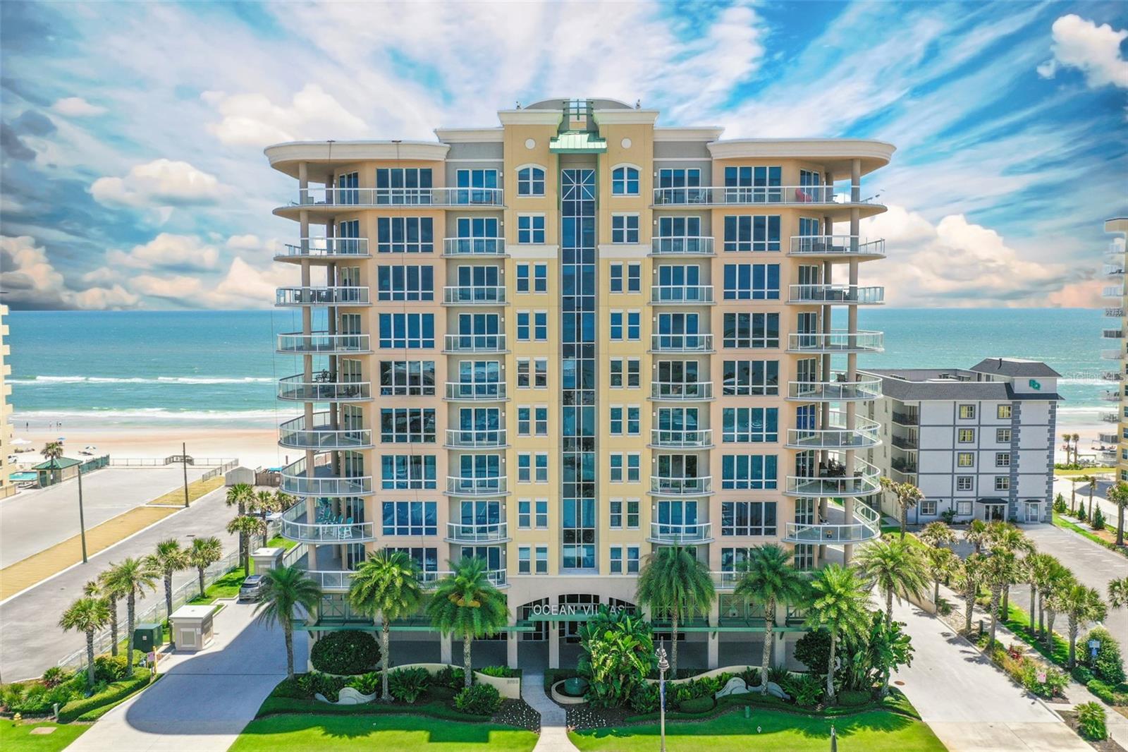 THIS LEADING LUXURY COASTAL CONDOMINIUM ESTATE UNVEILS A DREAM LIFESTYLE REVEALING FIRST-CLASS AMENITIES PAIRED WITH 5 STAR SERVICES. THE MAGNUM OPUS OF OCEAN VILLAS OFFERS EXPANSIVE LIVING IN ALMOST 4,000 SQ FT AND 2 PRIVATE SIDE BY SIDE PARKING SPACES. LOCATED ON THE CLUB LEVEL W/ AN IDYLLIC BLEND OF SPACIOUS, PRIVATE LIVING WITH HOSPITALITY INSPIRED CONVENIENCE. THE DOUBLE DOOR ENTRY OPENS TO A DREAMLAND WHERE EVERY WALL IS SCULPTURE, FLAUNTING S SHAPES, MORE AKIN TO ART THAN ARCHITECTURE AND THE CREAMY GLOSS, PORCELAIN FLOORING TRAVELS THROUGHOUT. THE ROTUNDA FOYER LEADS TO THE ZSA ZSA ZSU HIGH-CLASS, OVER THE TOP AND GLAMOROUS FEELING OF AWESTRUCK REVERANCE. THE FLOOR PLAN HAS 2 WINGS THAT EXTEND FROM EACH SIDE OF THE CENTRAL LIVING SPACES. LIKE A GLASS PRISM FLOATING ABOVE THE OCEAN, WALLS THAT BLUR THE BOUNDARY TO THE ALEROS BALCONY, WHERE EVERY MAJOR ROOM PROVIDES DIRECT ACCESS TO THE OUTDOOR SPACE. THE OWNER'S SUITE IS 1 OF 1, WITH HIS AND HERS BATHS THAT PROVIDE OWNERS WITH

PRIVACY THEY NEED TO GET READY FOR THE DAY. OWNERS EACH HAVE THEIR OWN RESTROOM SPACE, VANITY AND WARDROBE CLOSETS, WITH A WALK THROUGH SHOWER CREATING A SPACIOUS GRAND BATH THAT AMPLIFIES THE CONCEPT OF PERSONAL LUXURY TO AN ENTIRELY NEW LEVEL.

THE GUEST BEDROOM WITH BALCONY ACCESS AND ELECTRIC, HUNTER DOUGLAS LUMINETTE BLINDS IS SERENE AND RELAXING.

THE ARCHITECT CREATED AN OPEN-SPACE LIVING, DINING AND KITCHEN AS ONE SHOW-STOPPING ENTERTAINMENT SPACE. A MASTERCLASS IN OPEN-CONCEPT LIVING WHERE THE KITCHEN STANDS AS THE HEART OF THE HOME RATHER THAN A SEPARATE ZONE. THE BAR STRETCHES TOWARD THE LIVING AREA PROVIDING BOTH A PREP SPACE AND CASUAL SEATING.THE UPPER CABINETRY SOARS TO DOUBLE HEIGHT AND THE PENDANT LIGHTING ADDS TO THE COHESIVENESS. PARTIES OFTEN END UP IN THE KITCHEN SINCE WALLS DISSOLVED AND FLOW INTO THE DINING AREA DESIGNED FOR LINGERING. THE CHUNKY DINING TABLE, STYLISH, DECORATOR LIGHTING WITH A FIREPLACE AS THE BACKDROP ANCHOR THE OPEN LAYOUT.
A DELUXE ENSUITE AND PRIVATE HOME OFFICE OR THEATRE ROOM WITH A POWDER ROOM BATH SHARE THE GUEST WING.
STEPS FROM THE OCEANFRONT FITNESS AND OWNER'S LOUNGE THIS CONDOMINIUM HOME IS THE PERFECT COMBINATION OF ARCHITECTURAL BRILLIANCE AND LIFESTYLE LUXURY.