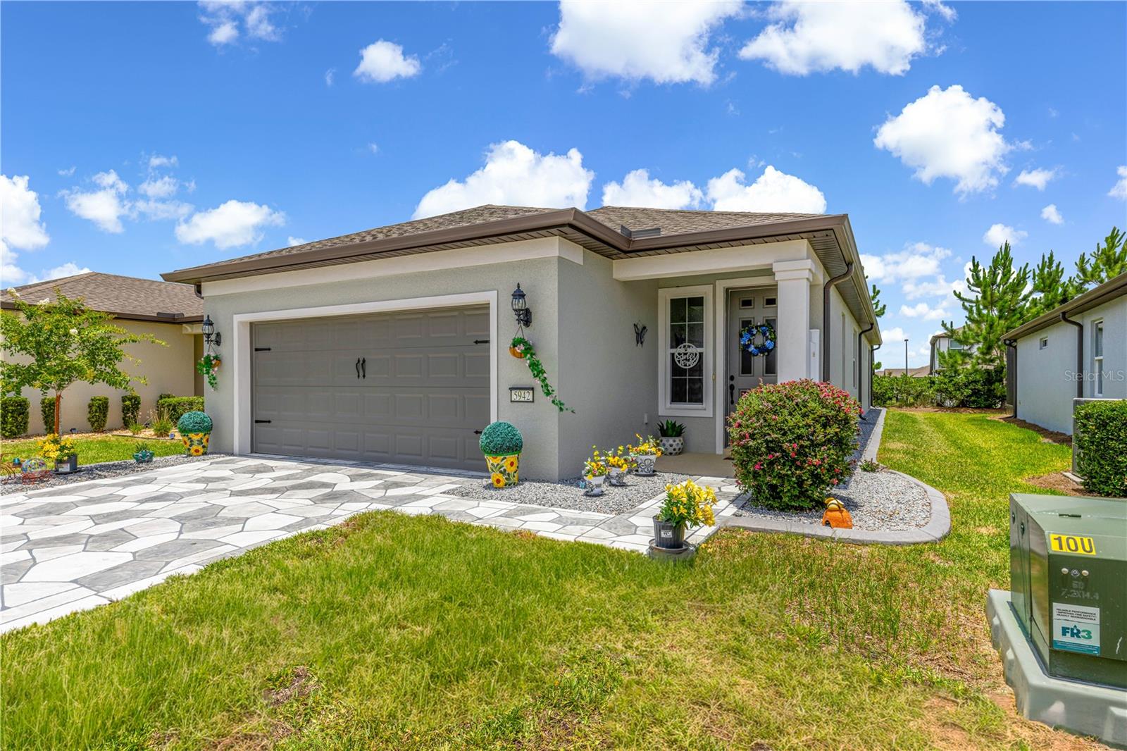 Welcome to this beautiful Hallmark model home in the premier 55+ community of Del Webb Stone Creek. Built in 2022, this thoughtfully designed home offers 1,656 square feet of comfortable Florida living with 2 bedrooms, 2 bathrooms, a versatile flex room, and a 2-car garage.
Step inside to discover tile flooring throughout and an inviting open layout designed for easy everyday living and entertaining. The bright white kitchen features a wall oven, cooktop, quartz countertops, and plenty of workspace for preparing meals and gathering with friends. The spacious living areas flow seamlessly toward the screened porch and private backyard patio, creating the perfect setting to enjoy your morning coffee, evening relaxation, or peaceful views of your outdoor space.
Enjoy the convenience of lawn and shrubbery maintenance included with your monthly fee, giving you more time to experience everything this incredible community has to offer.
Del Webb Stone Creek provides an exceptional active adult lifestyle with outstanding amenities and endless opportunities for recreation, relaxation, and social connections. Enjoy the indoor pool, outdoor resort-style pool, pickleball, tennis, bocce, softball, card rooms, billiards, craft room, golf simulator, fitness opportunities, and so much more.
At the heart of the community is the impressive Stonewater Club, where residents gather for live music, social events, and time with friends while enjoying the beer and wine bar and beautiful views of the water features. Whether you are looking for activities, new friendships, or a place to enjoy the best of retirement living, this home offers the perfect combination of comfort, convenience, and community.