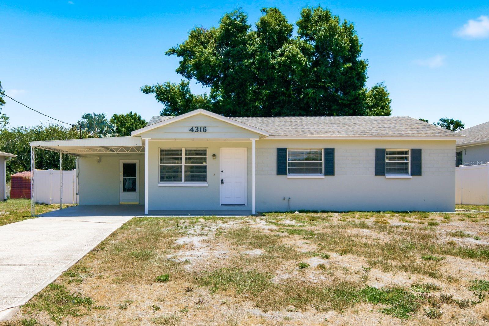 Welcome to 4316 S Hale Ave, a well-maintained block/stucco ranch on a large lot in the heart of South Tampa. Brand-new luxury vinyl plank flooring runs throughout all three bedrooms and living areas, giving the entire home a fresh, move-in ready feel. The kitchen features raised-panel wood cabinetry, dark granite countertops, and a full appliance package including refrigerator, range, microwave, and dishwasher. Each bedroom is bright and airy with ceiling fans and ample closet space. The updated bathroom includes a full tub/shower with tile surround. Step out back into a spacious enclosed Florida room bathed in natural light — a perfect bonus space for entertaining, a playroom, or just relaxing year-round. The fully-fenced backyard offers plenty of room to spread out. A covered carport rounds out this well-appointed home. The roof was replaced in 2023 for added peace of mind. Home is walking distance to top-rated Kenneth Adum Elementary Magnet School. Minutes to MacDill AFB, Bayshore Blvd, and the best of South Tampa dining and shopping.  Schedule your showing before it's gone