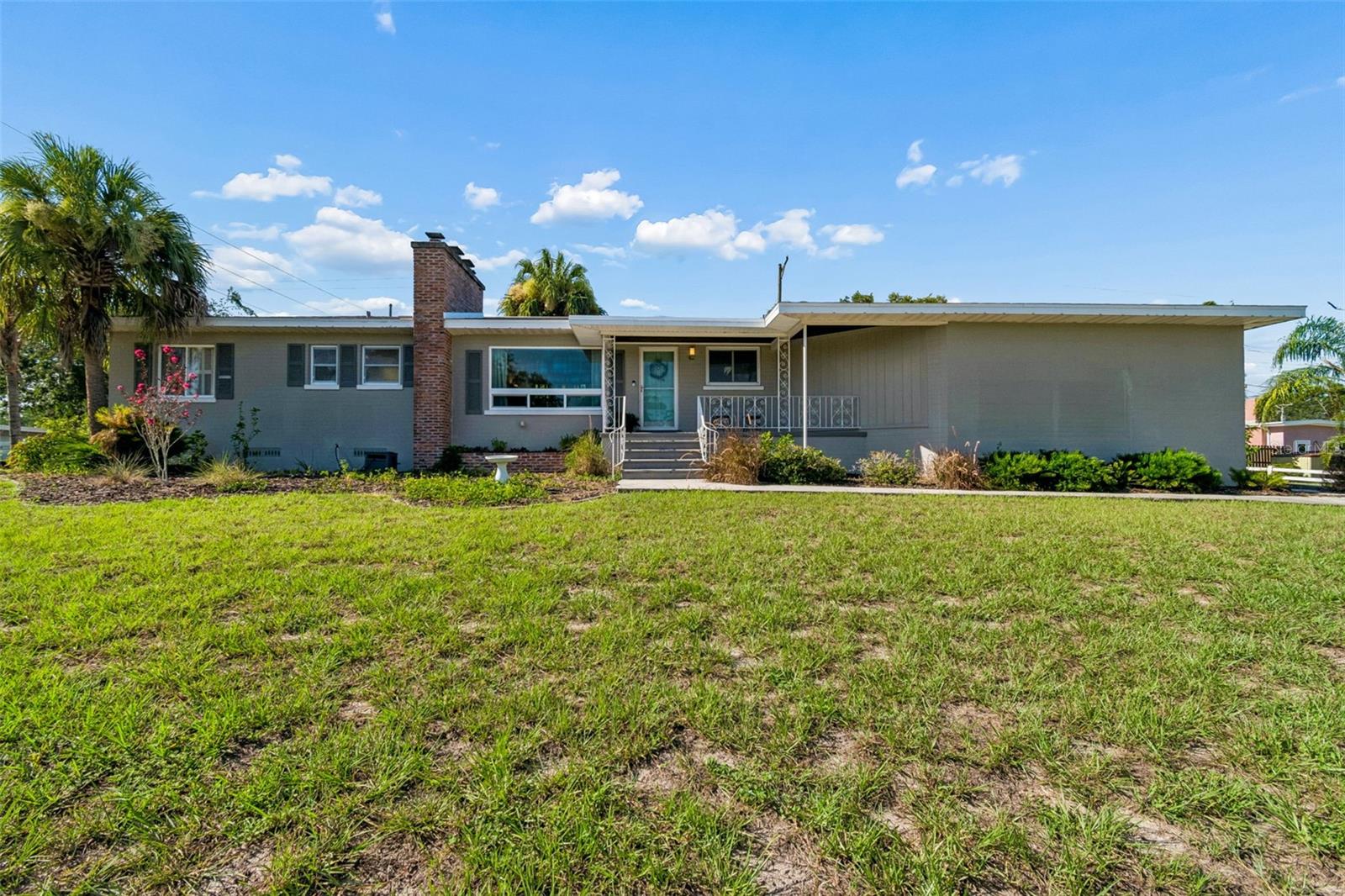 Charming 1950s ranch on an oversized lot in a perfect Temple Terrace location. Enter through the front door into a cozy living room featuring a striking brick fireplace and a large picture window overlooking the expansive front yard. Off the living room is a dining area that leads to the stylish kitchen with cork floors and butcher block countertops.
Just beyond the dining space is a light-filled office with a private exterior entrance—ideal for working from home, a studio, or a quiet retreat. A hallway off the living area leads to the bright primary suite with an en suite bathroom, two additional bedrooms, and a hall bath.
The home sits high on an enormous corner lot with plenty of space for a home garden, play area, or simply enjoying the extra room to spread out.
Located on a quiet street near Bonnie Brae Park and less than a mile from Temple Terrace amenities, including the Recreation Center, Golf & Country Club, and library, this home offers the best of small-town charm with the convenience of city living. Temple Terrace is one of the few areas in Tampa that truly has a community feel. Residents enjoy several parks, playgrounds, and boardwalks along the Hillsborough River with boat access, family-owned restaurants, beautiful architecture, tree-lined streets, and community events throughout the year—including a Fourth of July parade, with this home located right along the parade route.
The Temple Terrace Golf & Country Club offers golf, a putting green, bar and restaurant, pool, and clubhouse. Its scenic golf course creates beautiful green space that winds throughout the city, adding to its character and charm. The Temple Terrace Recreation Center features clay tennis courts, a newly renovated gym, and activities for all ages, including dance, sports, and gymnastics.
Conveniently located near USF, Moffitt Cancer Center, Busch Gardens, Adventure Island, and Interstates 275 and 75. No HOA. No CDD.