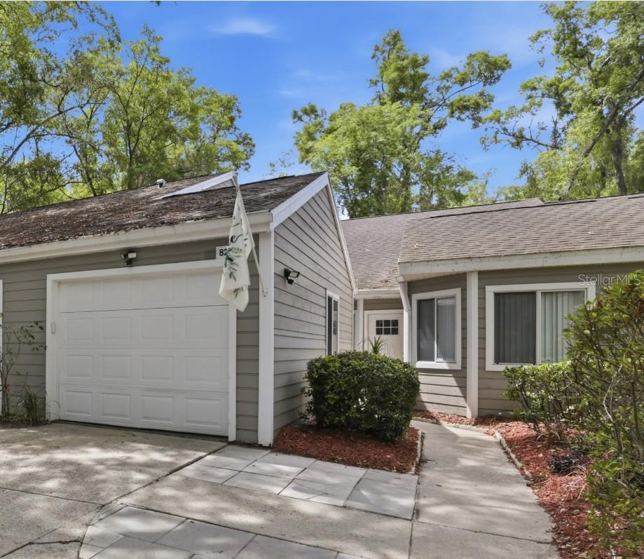 Welcome to this beautifully updated single-story villa with one-car garage in the desirable Villas of West End, ideally located near Tioga Town Center and the newly redeveloped West End Community Park. This light-filled 2-bedroom, 2-bath home offers 1,406 sq. ft. of thoughtfully designed living space including a flexible office or den that can easily serve as a work-from-home space, reading room, hobby area, or additional guest space.
A charming front courtyard between the garage and home creates the perfect spot for a garden or café seating to enjoy your morning coffee. Inside, vaulted ceilings, newer interior paint, newly replaced Pergo flooring, and abundant natural light create an open, airy feel throughout. The living and dining areas flow together beautifully, framed by glass sliders that open to an expansive rear patio overlooking a peaceful wooded backdrop - the perfect place for outdoor grilling and entertaining!
The newly updated kitchen features stainless steel appliances, upgraded cabinetry, luxury laminate countertops, and a double pantry for exceptional storage. The split-bedroom floor plan offers privacy, with the guest bedroom and bath positioned on the opposite side of the home from the spacious primary suite. The primary retreat features a massive walk-in closet, a beautifully updated double vanity, and a large walk-in shower.
Additional highlights include a large one-car garage and a bonus storage room inside the home that could be reimagined as an interior laundry room, craft room, gaming space, or additional functional flex area. TONS OF STORAGE SPACE! The HOA maintains the exterior, including the roof and siding, offering low-maintenance villa living in a fabulous Gainesville location. Newly replaced water heater (2019) for hassle free insurance!
With its updated finishes, bright open layout, private outdoor living, and easy access to shopping, dining, parks, and recreation, this Villas of West End home is a rare opportunity to enjoy comfort, style, and ease in one of Gainesville’s most coveted areas.