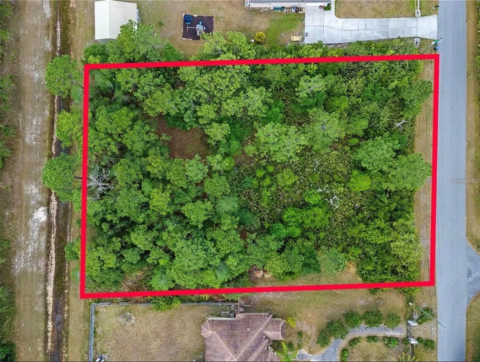 Private 1.24-acre homesite in the desirable Wedgefield area of Orlando featuring 180 feet of frontage and approximately 300 feet of depth. This oversized lot backs up to a natural creek buffer, offering added privacy with no direct rear neighbors and plenty of room to build your custom dream home, workshop, detached garage, or outdoor living space. Located in a quiet estate-style community with well and septic typical for the area, while still being conveniently close to Orlando International Airport, Lake Nona, UCF, and major roadways. Large homesites with this kind of privacy and space are becoming harder to find in East Orlando, making this a great opportunity to build now or hold as an investment. Buyer to verify all building requirements and utility availability.