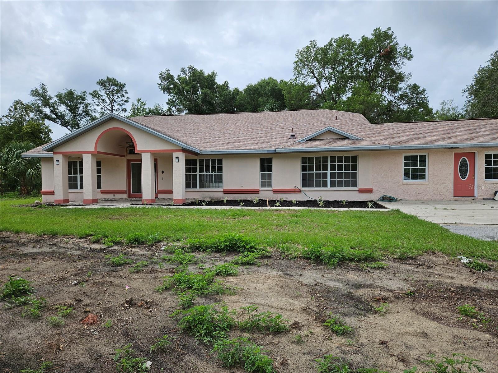 Impressive 4 br, 3 1/2 bath, split plan home on 4.34 acres on Highway 40 E in Inglis . Caged, inground pool, db garage, shop & carport . Over 3,400 ' living area, and over 4,200 ' under roof. Cathedral ceiling, awesome great room, tile floors throughout home . New roof in November, 2016. New pool pump in 2023. DIAMOND IN THE ROUGH ! Endless possibilities with this massive home and open plan. Pool is working, but needs some refreshing . Property has been Bushhogged and cleaned up, but would be awesome with more grass, landscaping or pasture? Huge Family room (30 x 15) with double pane glass sliders that open to pool & lanai. Lots of nice fans w/lights in most rooms. Inside utility w/washer & dryer. Lots of extra storage space. Finished (20 x 20) garage w/heat & a/c .