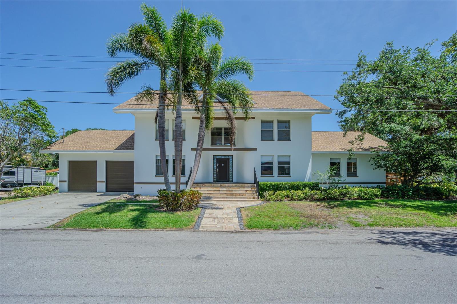 No flood history, move-in ready 3 bed, 3 bath home features a bonus room on the first level with an attached full bath and closet, making it a 4 bed, 3 bath layout. The bonus room can serve as an office, media room, or extra bedroom. Located in the highly sought-after Sunset Park neighborhood of South Tampa, this elevated, all-block solid home withstood hurricanes Helene and Milton and was fully renovated in 2024. Situated on a spacious corner lot at the entrance of a quiet cul-de-sac, it blends modern design, functionality, and classic Florida charm. The home has lots of closet space, an upstairs laundry room and wood-burning fireplace. Step outside to a private deck and backyard oasis. Additional features include a dining area, a bonus space ideal for a home office or playroom, a two-car garage with one bay converted into a central air-conditioned room, and brand-new appliances. Within the A+ rated Plant High School District and minutes from premier shopping, dining, and Tampa International Airport, this home offers modern comfort in one of Tampa's most desirable neighborhoods. Showings are available on appointment, please call or text the listing agent.