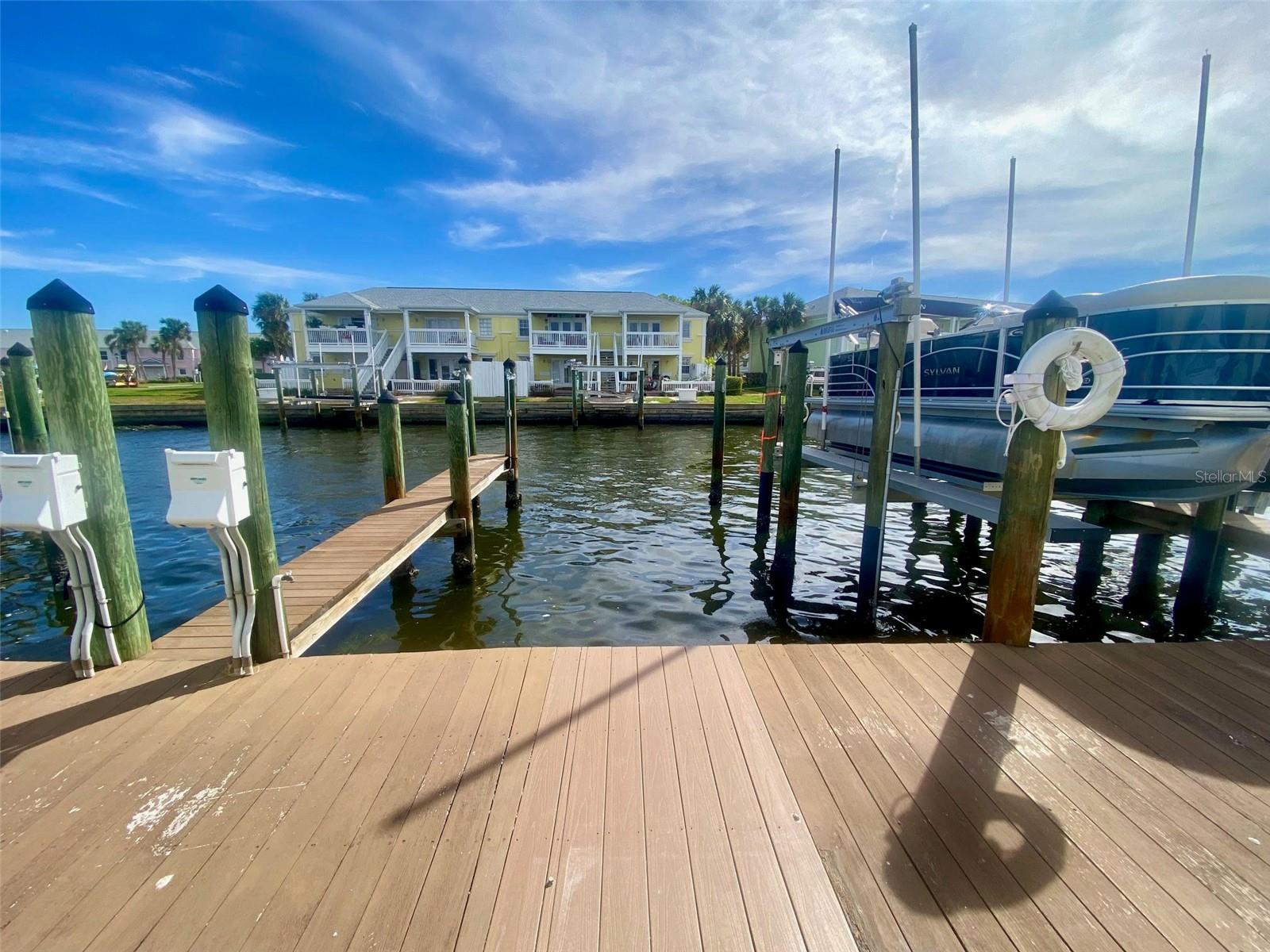 **Boat Slip for Sale – Your Gateway to Tampa Bay**

Enjoy the ultimate boating lifestyle with this well-appointed 14' x 12' composite boat slip, ideally located within the gated waterfront community of Waterside at Coquina Key South. Step from your home to your boat and be cruising the open waters of Tampa Bay in minutes via Canal 4—with **no fixed bridges** to slow your adventure. From the dock, take in beautiful views of Tampa Bay and the iconic Sunshine Skyway Bridge.

The slip is equipped with electric, water, and dock lighting, and can accommodate vessels up to approximately 30 feet. A community fish cleaning station is conveniently located nearby, making it easy to clean your catch after a day on the water.

This slip isn't just for boat owners. Jet skis, personal watercraft, and water bikes are also permitted within your assigned slip, provided they operate in accordance with community no-wake regulations.

Ownership is easy thanks to the Condo Dock Association, which professionally manages dock maintenance, allowing you to spend more time enjoying life on the water and less time worrying about upkeep.

Whether you're an avid boater, fisherman, or simply dreaming of effortless access to Tampa Bay, this is a rare opportunity to own your own piece of Florida's waterfront lifestyle. Schedule your private showing today!

MUST OWN OR RENT IN EITHER WATERSIDE AT COQUINA KEY NORTH OR SOUTH TO OWN A DOCK.  Docks can be rented to other residents when not in use.  Renters must be registered with the association.  Unit being sold without a dock box.