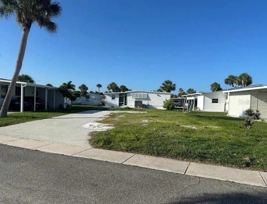 VACANT LOT in Japanese Gardens Mobile Home Community. Japanese Gardens is an active 55+ community in the perfect location to enjoy the activities in both Downtown Englewood and Venice and approximately 2 miles to Manasota Beach! This lot is ready for a new home! It is centrally located in the community on a quiet side street. Located towards the front of the park and near the clubhouse, pool, and spa! The size of the lot is 50'x80'.
