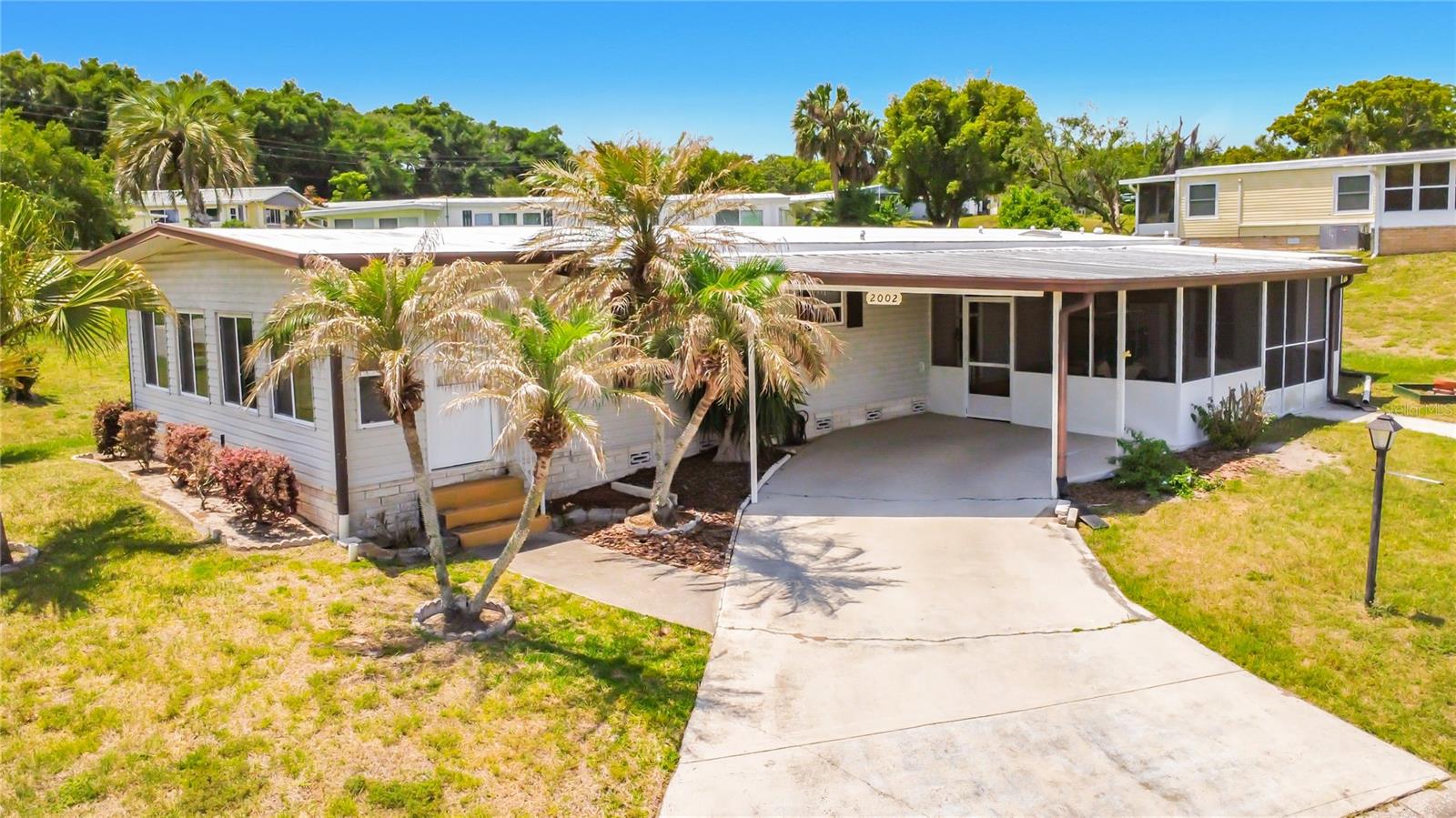 Bring Your Vision to This Spacious Corner Lot Home in Zellwood Station

Enjoy the Florida lifestyle in this 2-bedroom, 2-bath home offering 1,632 square feet, ideally situated on a large corner lot within the sought-after 55+ gated golf course community of Zellwood Station. Known as one of Central Florida's most established and amenity-rich active adult communities, Zellwood Station offers a vibrant lifestyle, beautiful surroundings, and exceptional value.

This property presents a fantastic opportunity for buyers looking to update and personalize to their taste. Thoughtfully priced to reflect updates needed, this home offers excellent value and the chance to create a space that truly fits your style. The golf cart is included!

Residents enjoy resort-style living with a 24/7 manned guard gate, gated entry, and on-site management.