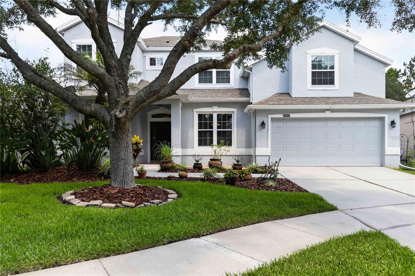 Some photos are virtually staged. This is the home you have been waiting for! Welcome to this exceptional MOVE-IN READY home located on a quiet cul-de-sac in the highly sought-after gated golf community of North Shore at Lake Hart in Lake Nona. Offering 4 bedrooms, 3 bathrooms, and 3,132 square feet of heated living space, this beautifully maintained residence combines timeless elegance, modern upgrades, and resort-style outdoor living. Major improvements provide peace of mind and exceptional energy efficiency, including ALL NEW ENERGY EFFICIENT WINDOWS (2024), NEW ROOF (2019), a NEW TRANE HVAC WITH HEAT PUMP UPSTAIRS (2020), NEW HVAC DOWNSTAIRS (2025), and a NEW HYBRID HOT WATER HEATER (2024). Surrounded by lush landscaping and featuring a remarkably private fenced backyard, the home boasts a SCREENED SALT WATER POOL AND SPA—perfect for relaxing or entertaining year-round. Inside, soaring ceilings and an open-concept floor plan create a bright, airy atmosphere, with the main living area open to the upstairs loft for an impressive sense of space. The chef's kitchen is designed for those who love to cook, offering stainless steel appliances, range with double ovens, gorgeous granite countertops, a spacious walk-in pantry, abundant cabinetry, and a BRAND NEW 27-CU.-FT. FRENCH DOOR STAINLESS STEEL REFRIGERATOR. A dedicated office/den provides flexibility and could easily be converted into an additional bedroom if desired, while the upstairs bonus room is ideal as a game room, home theater, family room, or play space. Three generously sized bedrooms, a full bathroom and a spacious loft are also located upstairs. The first-floor primary suite is a true retreat, featuring a spa-inspired bath with a double vanity and makeup area, an oversized custom shower, and a large walk-in closet with premium Closets by Design organization systems. Residents of North Shore at Lake Hart enjoy an outstanding array of amenities, including a fitness center, tennis and basketball courts, playground, dog park, golf course, clubhouse, walking trails and a community dock on beautiful Lake Hart. Tree-lined streets and a welcoming atmosphere make this one of Lake Nona's most desirable neighborhoods. Conveniently located near Lake Nona's premier dining, shopping, and Medical City, with easy access to SR 417 for quick trips to Orlando's world-famous theme parks, beaches, and everything Central Florida has to offer. This meticulously maintained one owner home truly offers the perfect combination of luxury, comfort, privacy, and convenience—make your appointment to see it today!