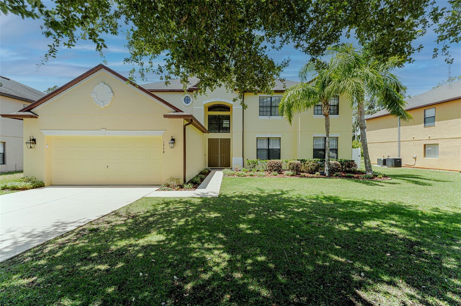 One or more photo(s) has been virtually staged. Lakefront Luxury, Everyday Ease! Discover 1778 Waterside Oaks Dr, Orange City, FL Dreaming of a spacious retreat where morning coffee comes with a private lake view and upgrades handle the hard work for you. Step inside, your solution to crowded living and costly remodels is already finished, styled, and waiting. This lightly lived-in, two-story, 6-bedroom, 4-bath beauty greets you with a tiled entry and sun-splashed interiors freshly painted from floor to soaring ceiling. Downstairs offers true multi-generational convenience: a generous master suite (custom walk-in closet, slider to the screened-in, tiled porch) plus a guest room and full bath nearby. Upstairs, nice carpet cushions quiet bedrooms, a bonus room, and dual-sink hall bath, perfect for teens, guests, or a home office wing. The gourmet kitchen is pure magazine bait: a massive island, stainless steel appliances with double ovens and cooktop, under-cabinet lighting, new Moen fixtures, and a walk-in pantry ready for Costco hauls. Tile floors flow to the eat-in nook and great room, where a stowaway sliding door blurs indoor-outdoor living onto that peaceful porch overlooking the lake reserve, ideal for sunset dinners without the mosquitos. Beyond the porch, the fully fenced backyard offers privacy and a safe space for pets or play. Need a pool? Your in luck, The backyard has plenty of room to add your own custom oasis. Comfort and efficiency are baked in: three Nest-programmed HVAC units (two just two years young, the third recently rebuilt), LED lighting, new ceiling fans, and a wired portable generator secured on a slab to keep essentials humming during rare outages. The reinforced garage door, new opener, motion lights, rain gutters, and storage shed add extra peace of mind. Need storage? You’ve got walk-ins galore, a utility-sink laundry, and closets at every turn. Love tech? Smart thermostats and under-cab lights deliver. Crave low mileage? The original owner only visited a couple of weeks a year—everything feels fresh. Ready to trade settling for comfort? Schedule your private tour and let 1778 Waterside Oaks Dr prove that your next chapter can start with a view and every upgrade already in place.