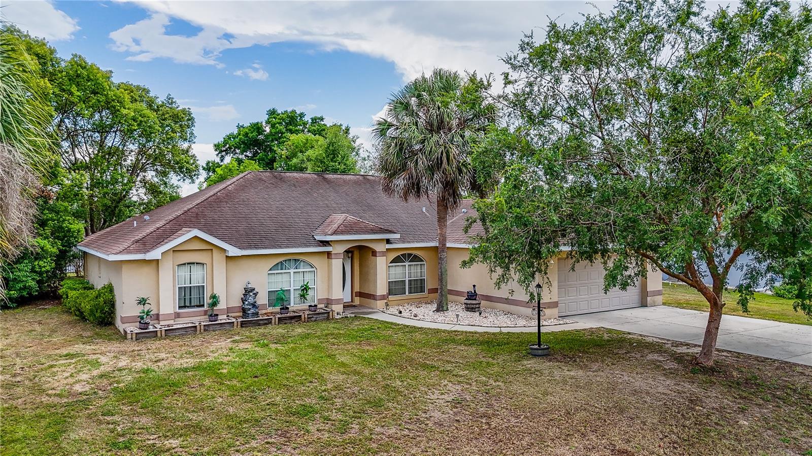 Nestled in the desirable Country Meadows community, this beautifully maintained 3-bedroom, 2-bath home offers over 2,100 square feet of thoughtfully designed living space. From the moment you arrive, you’ll appreciate the mature landscaping, inviting curb appeal, and peaceful neighborhood setting.

Inside, you’ll find a spacious split-bedroom floor plan featuring a versatile den/flex room—perfect for a home office, hobby room, or guest space. The bright kitchen includes updated appliances, a cozy breakfast nook, and opens seamlessly to the main living areas, making entertaining effortless.

The true highlight is the expansive Florida room and screened lanai, providing the perfect place to enjoy your morning coffee, host family gatherings, or simply relax while overlooking the beautifully landscaped backyard. A detached workshop with electricity offers endless possibilities for storage, woodworking, crafts, or your favorite hobbies.

Additional features include an inside laundry room, skylight for added natural light, walk-in closets, a two-car garage, and a low HOA.

Conveniently located near shopping, dining, medical facilities, and all that Ocala has to offer, this move-in-ready home combines comfort, functionality, and exceptional value. Don’t miss your opportunity to make this Florida gem your own—schedule your private showing today!