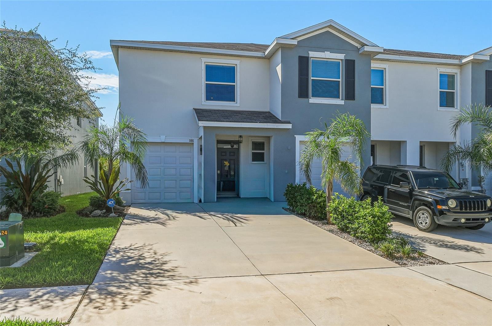 MOVE-IN READY! Built in late 2024, this beautifully maintained end-unit townhome combines modern design, quality two-story concrete block construction, and low-maintenance living in the desirable Mangrove Point community. All appliances will be brand new with warranties! 
The bright, open-concept floor plan is filled with natural light thanks to additional end-unit windows, soaring ceilings, and ceramic tile flooring throughout the main living areas. Enhanced with numerous owner-selected upgrades, the contemporary kitchen features quartz countertops, a custom tile backsplash extending to the kitchen island, upgraded cabinet hardware, a reverse osmosis water filtration faucet, and stainless steel appliances.
Triple-pane sliding glass doors open to the screened lanai, complete with a ceiling fan, creating the perfect space to enjoy your morning coffee, entertain guests, or relax at the end of the day.
Upstairs, the spacious primary suite offers two walk-in closets and a private ensuite bath. Both bathrooms have been upgraded with custom shower tile, while the primary bath also features glass shower doors and a custom MirrorMate-framed mirror. A versatile loft provides flexible living space ideal for a home office, media room, fitness area, or reading nook, while the generously sized secondary bedrooms offer abundant natural light.
Additional upgrades include designer lighting throughout, custom cabinet and door hardware, a professionally installed security system, smart home technology, and numerous custom finishes that enhance both style and functionality.
Residents enjoy low HOA fees that include exterior ground maintenance, water, sewer, and access to community amenities, including a community pool and playground.
Conveniently located just minutes from shopping, grocery stores, restaurants, and local favorites such as Circles Waterfront Restaurant, Apollo Beach Nature Park, and Wolf Branch Creek Nature Preserve, this home also offers easy access to Tampa Bay boating, waterfront dining, parks, and major commuter routes.
Why wait for new construction? This nearly new, turnkey end-unit townhome offers the advantages of a recently built home with owner-added upgrades already completed. Combining modern finishes, thoughtful enhancements, and a convenient Apollo Beach location, this home is ready for its next owner to move in and enjoy.