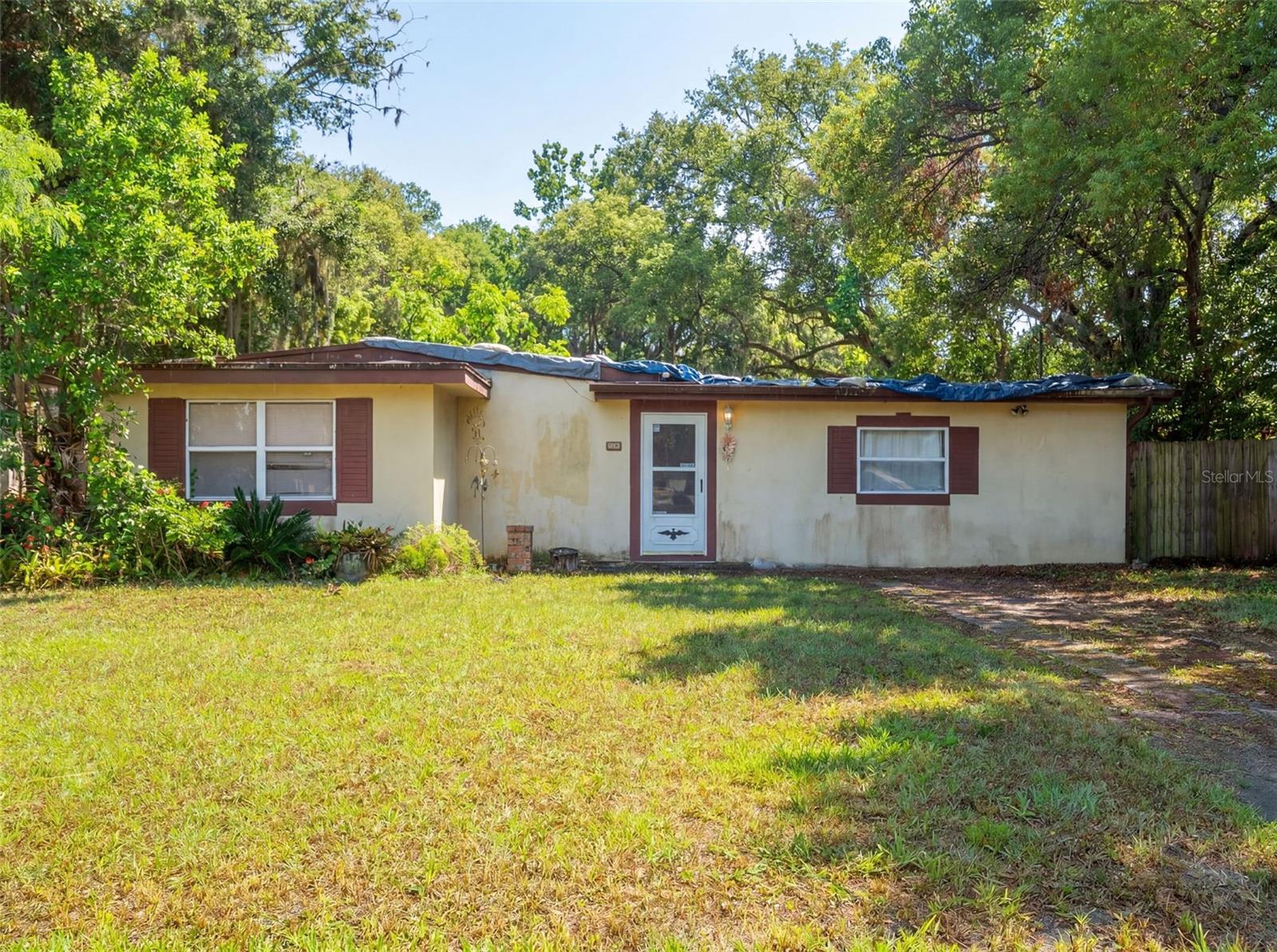 Virtually Staged. Opportunity knocks in East Orlando! This solid block-construction 3-bedroom, 2-bath home sits on a generous 1/4 acre corner lot on Churchill Street — just off Dean Road near SR 50.  This fixer-upper needs some TLC but offers a blank canvas ready for your vision. The spacious kitchen features a gas range, walk-in pantry and breakfast nook. The Great Room is open to the kitchen and overlooks into the backyard. Down the hall, the Primary Bedroom features a sitting room and ensuite bathroom with walk-in shower. The two additional bedrooms share a hall bathroom. The large fenced lot gives you flexibility for outdoor living, ample space for RV parking, trucks, boat or to add a pool.  With no HOA restrictions, this property offers the remodel the property as your own. You'll love the proximity to Jay Blanchard Park and direct access to the Little Econ Trail — perfect for biking, sports or weekend nature walks just minutes from your front door. Whether you're a first-time buyer looking to build equity, an investor seeking strong rental potential or a homeowner ready to personalize every detail — this is your chance to get into a great location at the right price.  Cash Only - home needs a new roof. Close to UCF, Valencia Community College and Full Sail. An easy commute to SR 417 & SR 408. Don't miss this one!