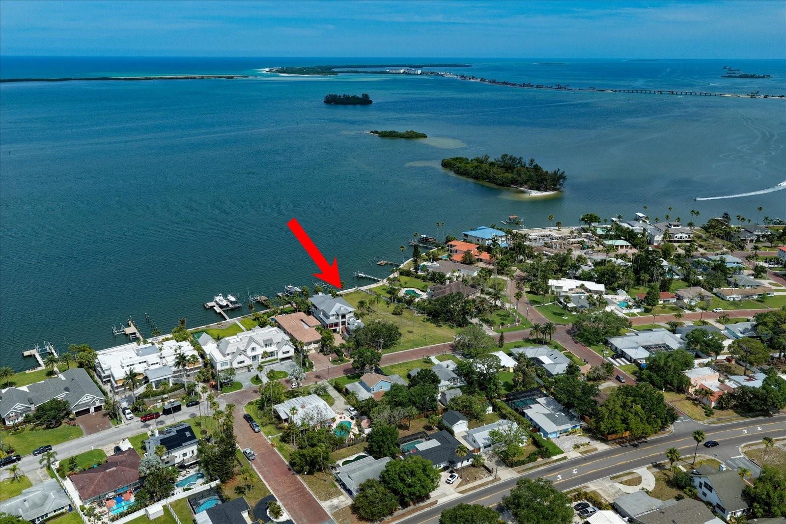 Virtually Staged. A rare opportunity to create a legacy waterfront estate on one of Dunedin's most prestigious brick-paved streets. Spanning more than one-half acre overlooking the Intracoastal Waterway and Caladesi Island, this exceptional home site offers breathtaking open-water views, spectacular sunsets, and a setting unlike anything else currently available in Dunedin.

Framed by iconic Washingtonian Palms and surrounded by luxury waterfront residences, the property combines privacy, scale, and an enviable location just moments from Downtown Dunedin's vibrant dining, shopping, breweries, marinas, and waterfront parks. Enjoy the convenience of golf-cart access to downtown and the Pinellas Trail just a few blocks away.

Whether you envision a contemporary coastal masterpiece, a timeless waterfront estate, or a resort-inspired retreat designed for entertaining on a grand scale, this remarkable property provides the canvas to bring that vision to life. The generous home site offers the opportunity to create a truly custom residence tailored to your lifestyle while maximizing panoramic water views and year-round sunset vistas.

To help illustrate the extraordinary potential of the property, conceptual renderings are available showcasing a custom waterfront residence specifically designed for this unique homesite by award winning Sarasota-based CMSA Architects. The featured concept includes approximately 8,000 square feet of thoughtfully designed luxury living space with a fitness room, pool cabana, detached golf simulator pavilion, expansive motor court, and resort-style outdoor living areas.

For buyers seeking to accelerate the design and planning process, the custom plans created by architect Rick Oswald of CMSA Architects are available separately and may provide a significant head start toward construction of a world-class waterfront residence.  Survey and geotechnical reports have both been done. The seawall was upgraded in 2022.

Come see an extraordinary setting and an irreplaceable homesite and seize this rare opportunity to create one of Dunedin's finest waterfront residences.