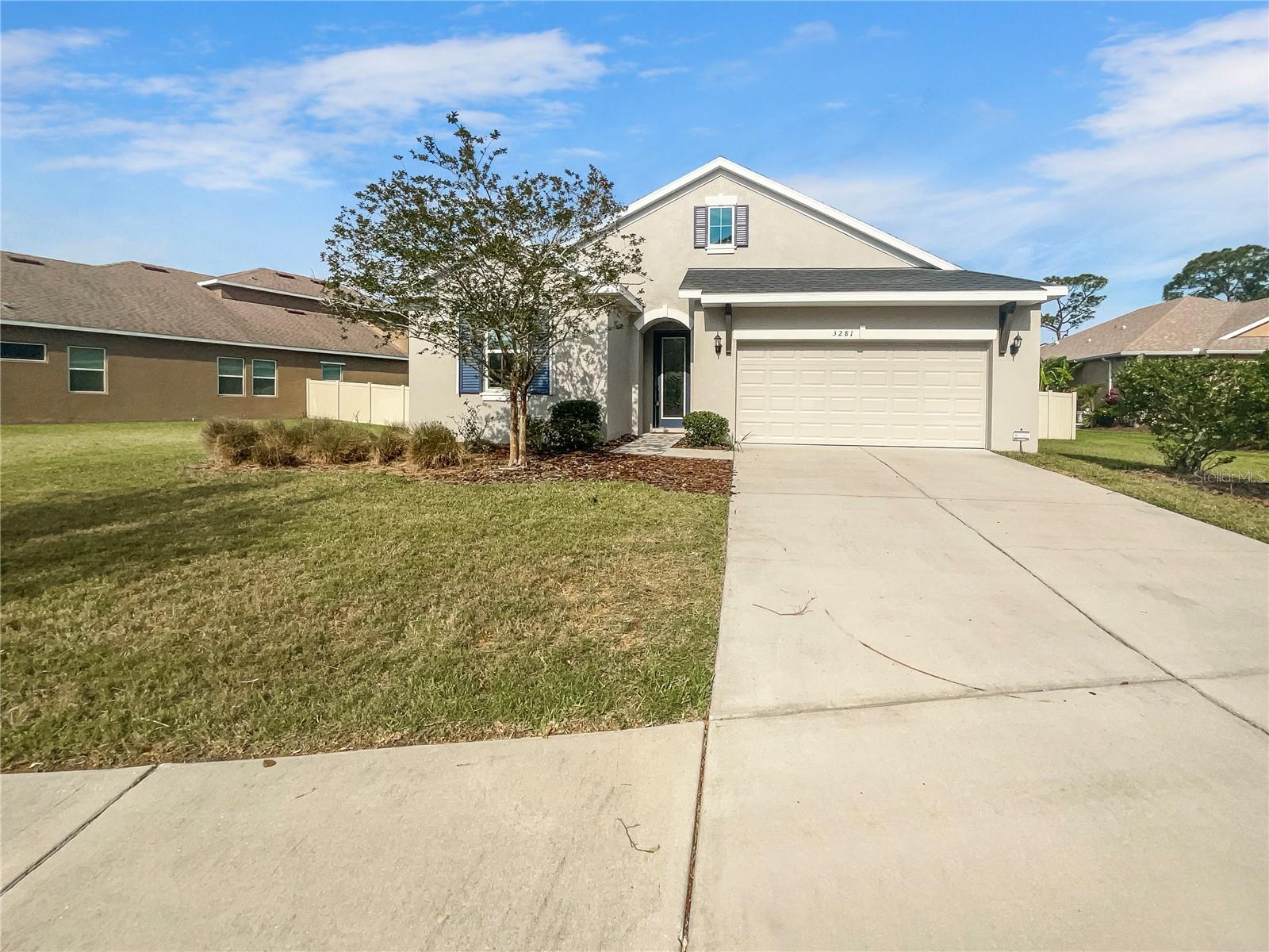 One or more photo(s) has been virtually staged. Don't miss your opportunity to own this 4 bedroom, 3 full bathroom and 2 car garage.  As you walk into the home you will have two bedrooms on the left side, which share a full bathroom.  Further down there is a 3rd bedroom which has its own private full bathroom.   This home offers a washer and dryer with an inside laundry room.   Large kitchen / great room combination.  The kitchen offers stainless steel appliances, a large pantry, and a double oven.  Enjoy the oversized kitchen island, which allows room for countertop seating.  The large master bedroom offers dual vanity sinks, a large walk-in closet and a separate bathtub and shower.  Enjoy your days and evenings on the back porch which has a view of the nature persevere.   Your backyard is also fenced for privacy.  Close to county parks and preserves and just a short drive to historic downtown Tarpon Springs.  Schedule your showing today!!!