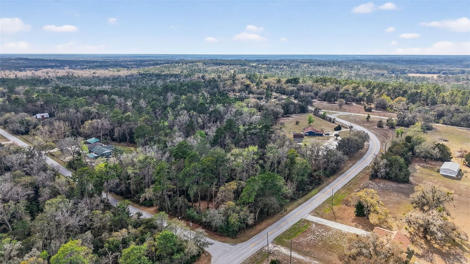 Located in the highly desirable rural community of Spring Lake in Hernando County, this 1.95-acre wooded parcel offers a rare opportunity to own land defined by privacy, natural beauty, and a picturesque creek setting. The winding creek along the rear of the property serves as a standout feature, creating a serene backdrop and an ideal setting for a future homesite designed to embrace the surrounding landscape.
Positioned on the corner of Powell Rd and Nancy Creek Blvd, the property provides both accessibility and seclusion. An access point from Nancy Creek Blvd leads into the parcel, where partial clearing has already been completed. This added improvement enhances the property’s value by allowing easier navigation of the land while offering a clear vision of its development potential, all while preserving the integrity of the mature trees and wooded environment.
Spring Lake is known for its spacious homesites, rural charm, and peaceful atmosphere, making it a sought-after destination for those looking to build a custom home surrounded by nature yet still close to convenience.
Zoned Residential R1C and located in Flood Zone X, this property offers flexibility for future plans while maintaining its quiet, natural setting.

With a recent price adjustment, this is a compelling opportunity to secure acreage with a water feature in one of Hernando County’s most desirable rural areas. Whether you envision a private retreat or a thoughtfully designed custom residence, this property provides the ideal canvas to bring your vision to life.