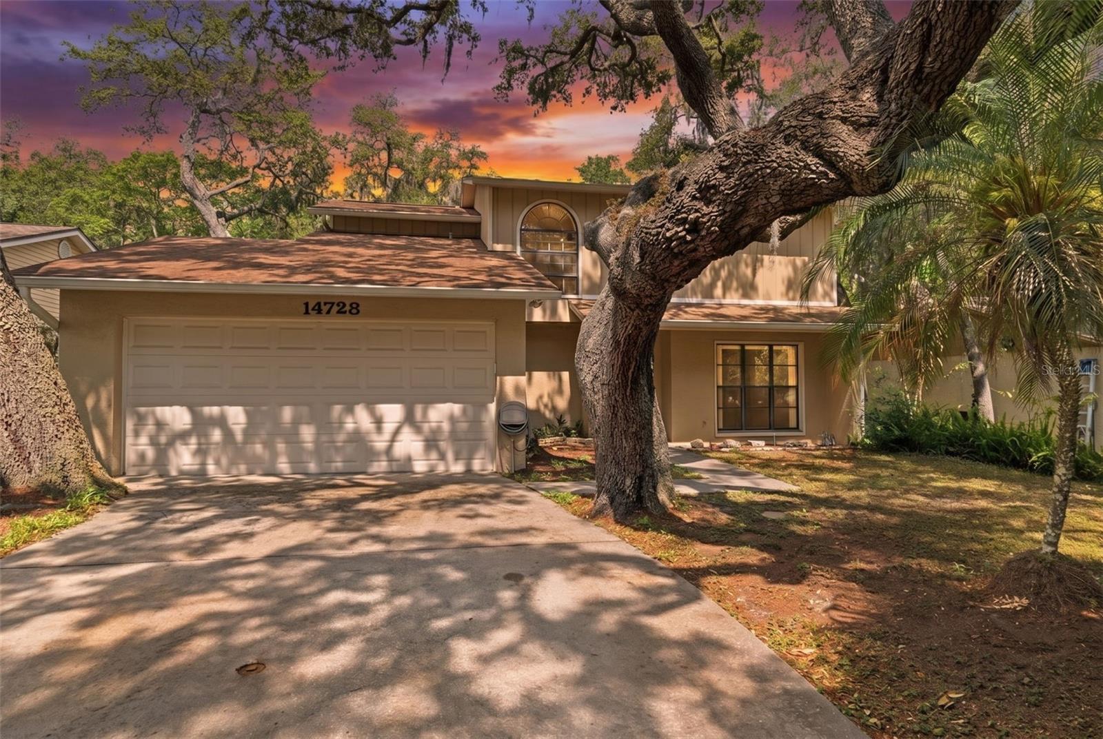 Unlock the full potential of Florida living in this spacious 4-bedroom, 2.5-bath Lutz home, offering the NO CDD fees. Step inside to discover easy-care wood-look flooring flowing seamlessly throughout the entire 1758 sqft residence, a stylish choice for our sunny climate, with lots of privacy on the property provided by the beautiful aged oak trees and landscaping. The inviting fireplace provides a lovely focal point, perfect for gathering on cooler evenings. Built in 1982, this home includes a convenient 2-car garage, providing ample storage and parking. With four bedrooms, there's generous space to accommodate everyone, whether it's for growing families, a home office, or guest quarters. Imagine creating your ideal Florida lifestyle here, close to all of the luxuries of Tampa Bay and top noch Florida beaches. This property offers a wonderful opportunity to embrace comfort and convenience in a sought-after Tampa Bay location. Make this welcoming house your new home!
