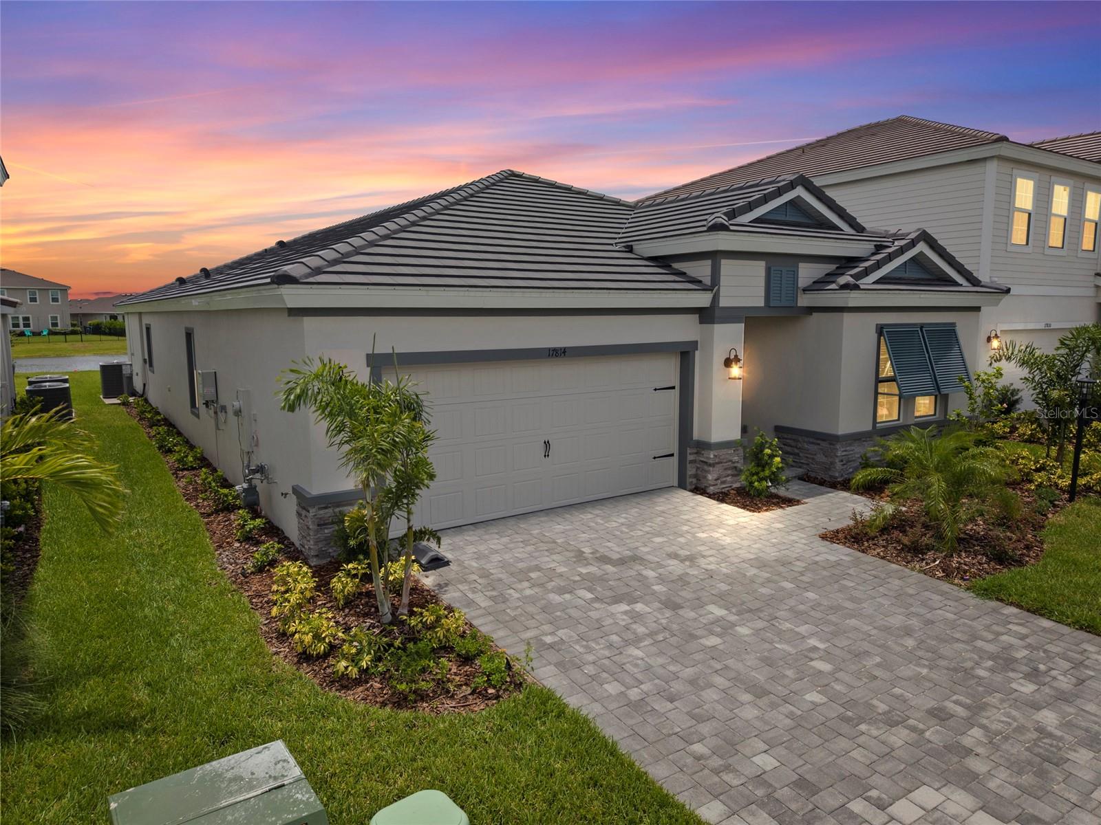 Virtually Staged. An exceptional opportunity to own a brand-new, never-lived-in Homes by WestBay Egret III, one of Star Farms’ most sought-after floor plans that is no longer available to build. Perfectly positioned on a premium waterfront homesite, this stunning residence offers serene water views and approximately $185,000 in designer upgrades, showcasing elevated finishes, timeless craftsmanship, and meticulous attention to detail throughout.

Built for both beauty and peace of mind, the home features hurricane-impact windows and doors and is pre-plumbed and prewired for a future pool and outdoor kitchen, making it effortless to create the ultimate Florida outdoor living experience.

Why wait 12-18 months for new construction when you can move into a luxury home today? Enjoy all the benefits of brand-new construction without the uncertainty of build timelines, design appointments, or escalating construction costs.

Located within the award-winning Star Farms at Lakewood Ranch, residents enjoy world-class resort amenities including multiple pools, fitness centers, sports courts, walking trails, restaurants, a coffee shop, dog parks, and an active year-round lifestyle.

This is a rare opportunity to own a highly upgraded, discontinued floor plan on a premium waterfront lot—an offering that simply cannot be duplicated. Schedule your private showing today.