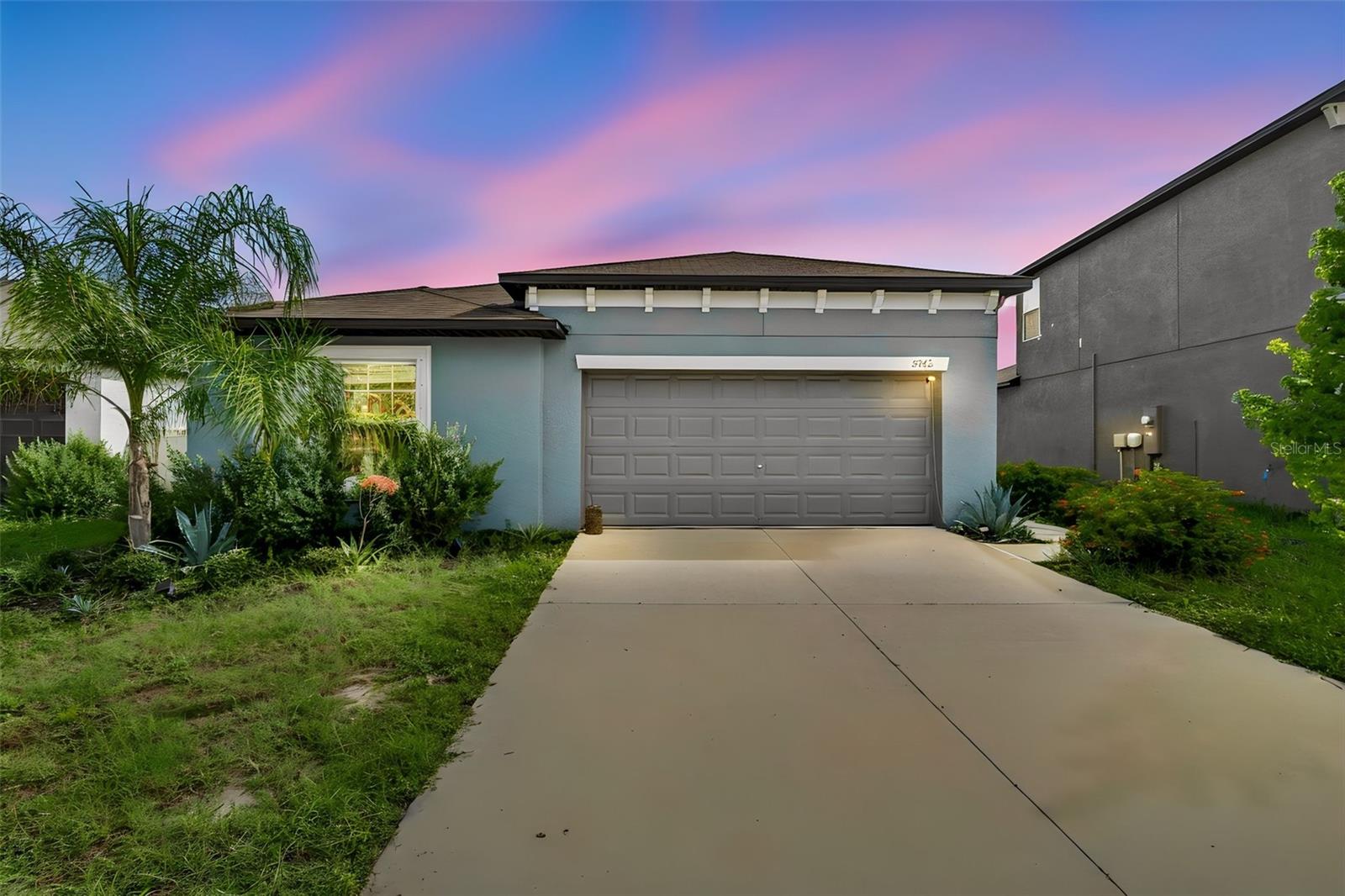 Built in 2023, this move-in-ready home offers 1,817 square feet of thoughtfully designed living space with a split-bedroom floor plan that provides both comfort and privacy.

The heart of the home is the modern kitchen, featuring granite countertops, stainless steel appliances, ample cabinet space, and an open layout that flows seamlessly into the living and dining areas—perfect for entertaining family and friends or enjoying everyday life.

Step outside to your fully fenced backyard overlooking a peaceful pond view, creating the perfect setting to unwind after a long day, host weekend barbecues, or simply enjoy Florida's beautiful sunsets. A spacious two-car garage provides plenty of room for parking and additional storage.

Berry Bay Estates offers exceptional community amenities, including a resort-style swimming pool, clubhouse, playground, basketball court, and tennis courts, giving residents plenty of opportunities to relax and stay active. With a low HOA and the home located outside of a flood zone, you'll enjoy added value and peace of mind.

Conveniently located near shopping, dining, schools, and major roadways, this home combines modern living with everyday convenience.