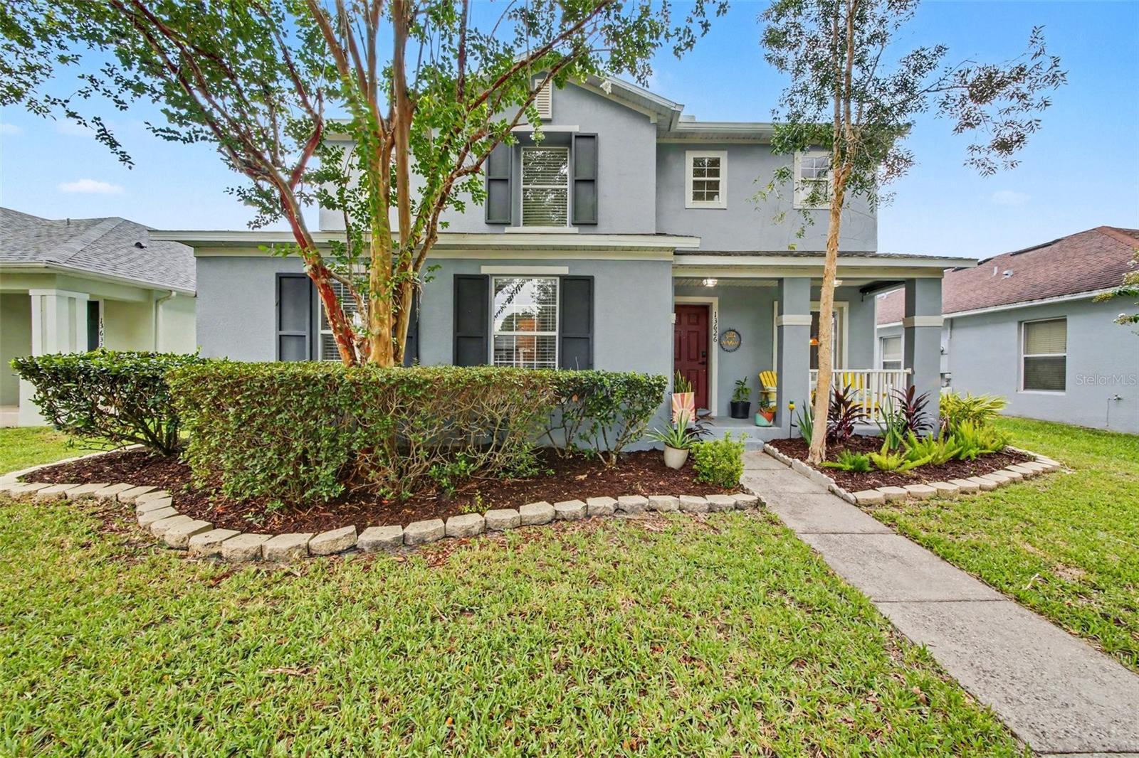 Welcome to the heart of Avalon Park, one of East Orlando’s most prized neighborhoods! With A-rated schools nearby, plenty of parks, and the sweetest Downtown Avalon marketplace just down the street, this location can’t be beat. Mature trees line the streets with dappled sunlight as you approach this stately property. A lovely front porch welcomes you before you step into your foyer. The living room is spacious and filled with plenty of natural light. Straight ahead is a large dining area, a breakfast nook, and the kitchen. Your kitchen features new wooden cabinetry, stainless steel appliances, new corian countertops, and a new copper sink. Tucked around the corner is the downstairs half bathroom, complete with freshly updated golden fixtures. Down a private hallway is the entrance to your downstairs primary suite. The primary bedroom is a great size and features a modern ceiling fan and an en suite bathroom. Your primary bathroom has dual vanities, upgraded wood cabinetry, a large combination tub and shower, a deep linen closet, and a spacious walk-in closet. The entire downstairs features tile and new laminate flooring. Heading upstairs, you enter a massive loft. Currently used as a spectacular playroom, this bonus space is basking in natural light and is perfect for a movie room, a multi-purpose room, or a large second living space. The laundry room is also upstairs, right next to the spare bathroom. The spare bathroom features a combination shower and tub, a newer vanity, and laminate flooring. Two of the three guest bedrooms have walk-in closets. Each guest bedroom is spacious and filled with natural light. Back downstairs, your attached two-car garage is right off the kitchen and faces the rear of the house. There is a long driveway via alley access for extra parking, and street parking is also allowed out front. Sliding glass doors lead you to your fenced-in backyard, where a white vinyl fence encloses your private green space. There are pavers ready for you to place furniture and a fire pit to start entertaining. Down the street are your community amenities: pickleball courts, a dog park, a splash pad, a playground, and a pool. Cable and internet are included in your HOA dues as well! The sweet town center has a myriad of businesses and restaurants, all within walking distance. You are also only 28 minutes to downtown Orlando, 45 minutes to Disney World, 30 minutes to Universal Studios and SeaWorld, 24 minutes to Orlando International Airport, 24 minutes to the University of Central Florida, and 45 minutes to SpaceX and Florida beaches. Rest easy knowing your water heater, roof, exterior paint, and HVAC system were all replaced within the last 3 to 4 years as well! Come see this lovely home in person and fall in love with Avalon Park! (There is a floor plan and virtual tour available for this property.)