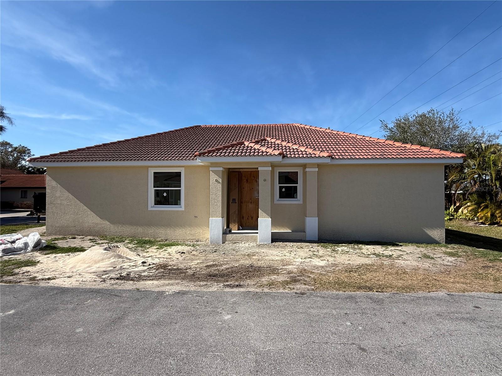 Under Construction. Large price reduction! Now painted outside and drywalled inside and the cabinets are installed! About a month away from completion! Custom Built Corner Lot Home West of 41! Don’t miss your chance to own a brand-new, custom-built home just minutes from the beach! This thoughtfully designed 3-bedroom, 2-bathroom home features an open concept floor plan with 1,400 sq ft of living space and nearly 2,000 sq ft total. Highlights include impact glass windows, durable tile flooring throughout, quartz countertops and a stylish tile roof.  
The owner’s suite offers a walk-in closet and a private bath, while the separate laundry room adds everyday convenience. A spacious 2-car garage completes the layout.  
Located on a desirable corner lot in a community where HOA is only $177/month and covers common ground maintenance, pool maintenance, road upkeep and insurance. Owners of properties in Sorrento Place are allowed to rent a boat slip at the Sorrento South Boat Basin.
Live close to the beach, west of 41, in a home tailored to your lifestyle!