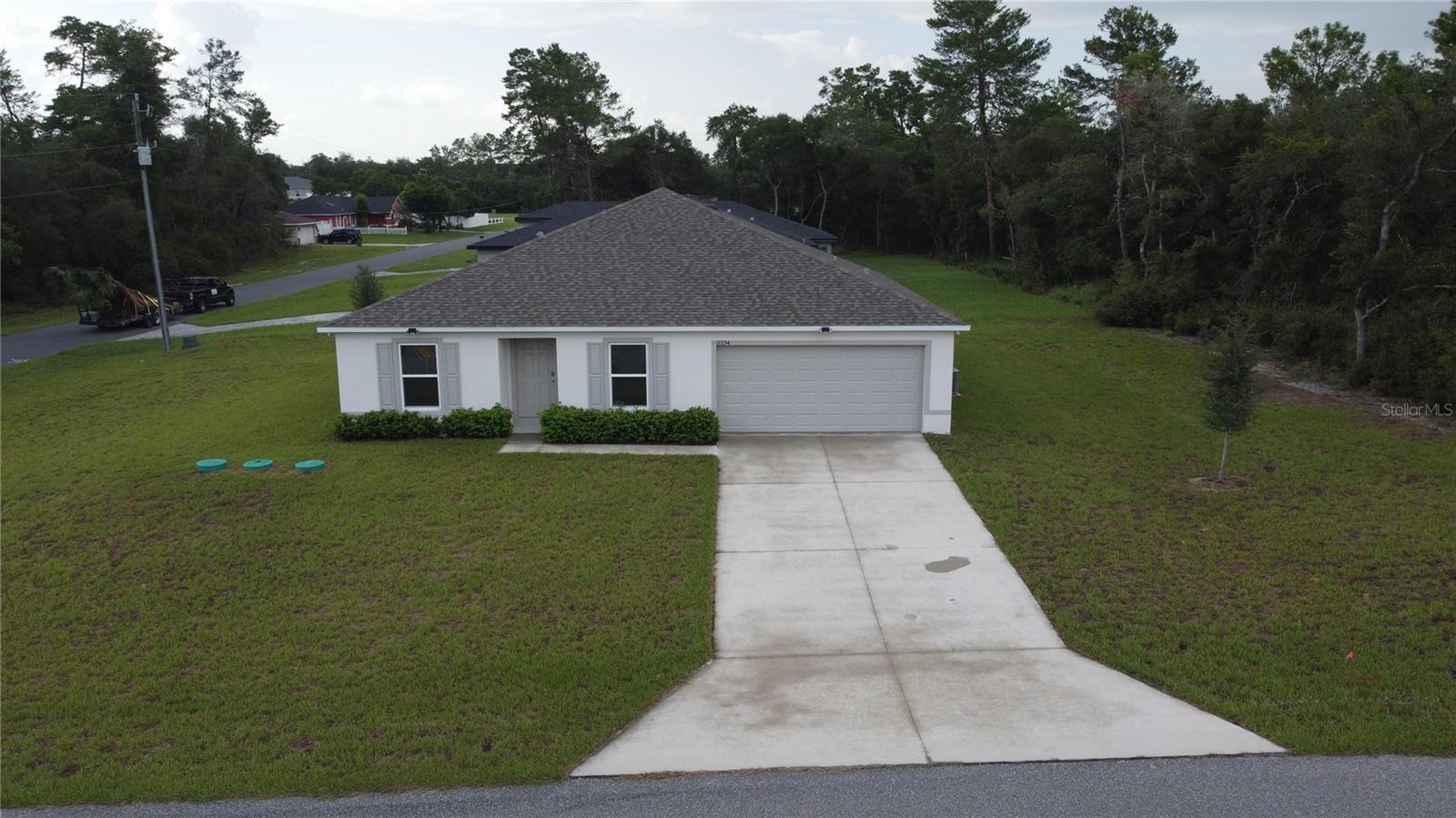 Better than new and move-in ready! Built in 2024, this beautifully designed 4-bedroom, 2-bathroom home offers 1,806 square feet of modern living on a generous 0.30-acre corner lot in one of Ocala's growing communities.
From the moment you step inside, you'll appreciate the bright, open-concept layout that's perfect for both everyday living and entertaining. The spacious kitchen seamlessly overlooks the living and dining areas. Features include stainless steel appliances, ample cabinet space, and a functional design that keeps everyone connected. The thoughtfully designed split floor plan offers privacy for the primary suite while providing three additional bedrooms perfect for family, guests, or a home office. Outside, the oversized corner lot provides plenty of room to create your dream backyard, add a garden, entertain outdoors, or simply enjoy Florida's year-round sunshine.
Whether you're a first-time homebuyer, relocating to enjoy a warmer climate, or looking for a low-maintenance, newer home without the wait of new construction, this home checks all the boxes. Conveniently located near shopping, dining, schools, medical facilities, parks, and Ocala's renowned natural springs, this home offers the perfect balance of peaceful living and everyday convenience.