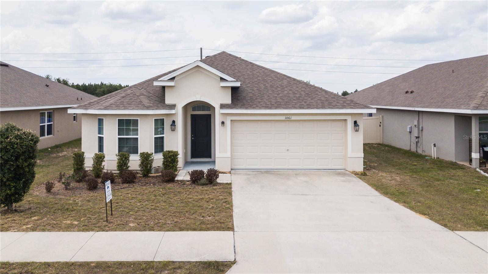 Prime location near Highways 27 and 17. This open-concept home features 3 bedrooms and 2 bathrooms, along with a fully fenced backyard and a covered back porch. Amenities include stainless steel appliances, tile flooring, and carpeted bedrooms. Situated on high, dry ground, this home is vacant, move-in ready, and waiting for you.