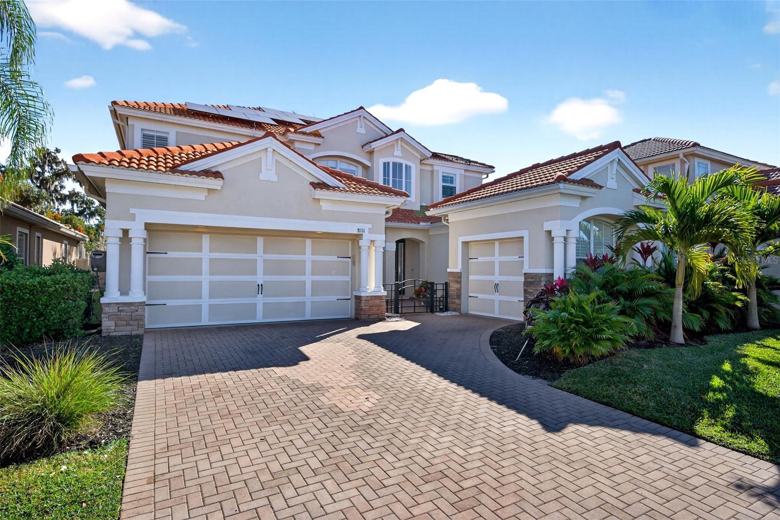 A rare offering in a gated Sarasota community—this luxury, solar-powered pool home with a generator delivers scale, security, and elevated Florida living. Designed for discerning buyers who value space, reliability, and thoughtful upgrades, this residence offers 5 bedrooms plus a bonus room and 3.5 baths, providing exceptional flexibility for refined modern lifestyles, multigenerational living, or executive work-from-home needs.

Welcome to 8111 Santa Rosa Court, gracefully positioned on a quiet cul-de-sac where privacy meets convenience. Inside, the home has been extensively upgraded with intention and care. New laminate flooring and interior paint were completed in 2022, followed by fully remodeled bathrooms in early 2023. The kitchen was reimagined in 2025 with new cabinetry and epoxy countertops, paired with updated kitchen appliances and laundry installed in 2022, creating a space that is both functional and beautiful.

This home stands apart for its infrastructure and preparedness. New AC systems and a new water heater (2022), solar panels installed in 2022, and a whole-house generator provide exceptional energy efficiency, resilience, and peace of mind—features increasingly sought after in luxury Florida real estate.

Outdoors, the private pool area has been transformed into a resort-style retreat. Upgrades include a new pump, filter, heater, and automation system (2022), a rescreened pool enclosure (2022), and a complete resurfacing with new tile and pavers (2024)—ideal for elegant entertaining or tranquil everyday enjoyment.

Located moments from shopping, dining, UTC Mall, major roadways, and Sarasota’s world-renowned beaches, this move-in-ready home offers a rare combination of space, upgrades, energy-conscious living, and gated-community privacy.

Currently tenant-occupied with an active lease in place. Lease details available upon request.