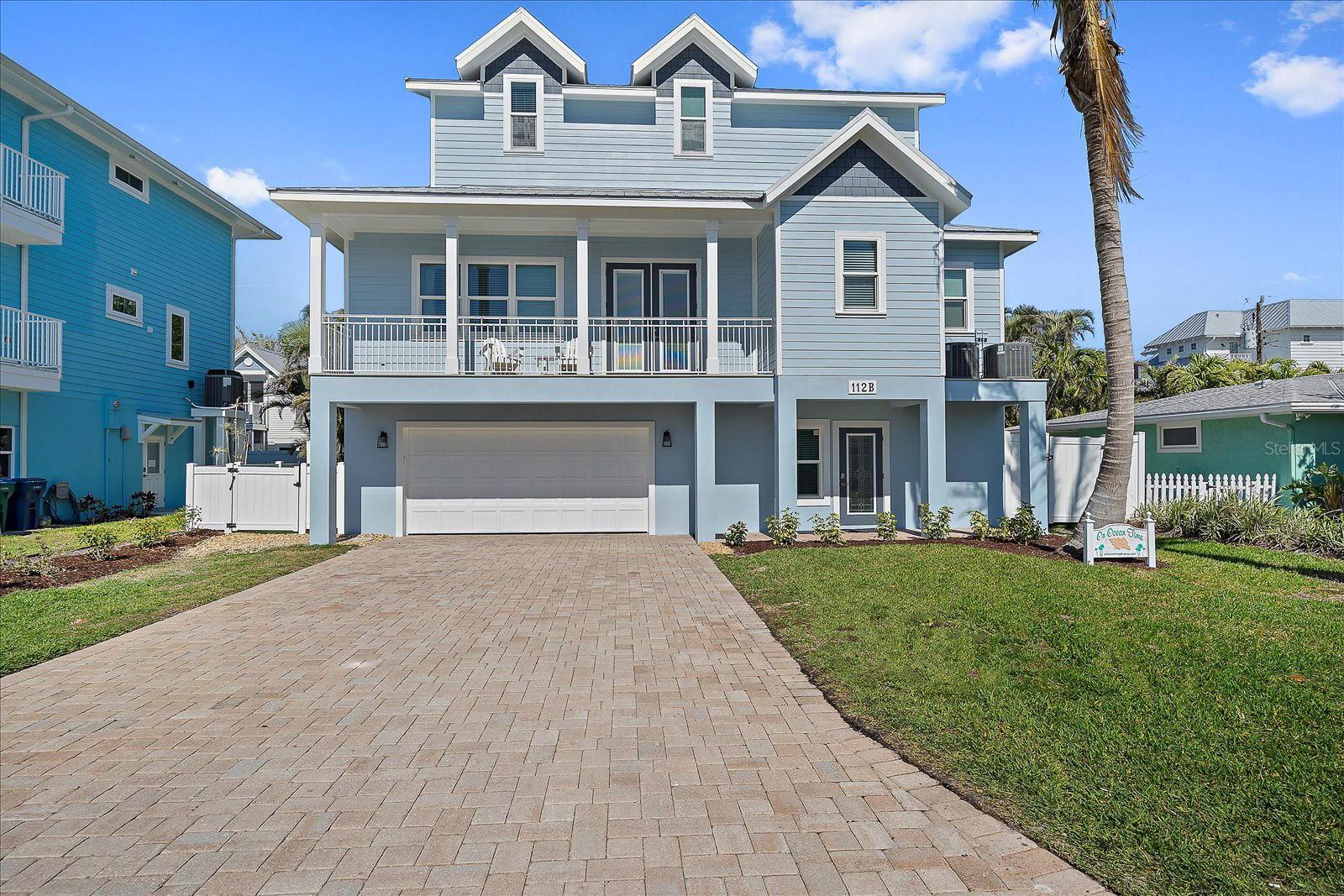 **The home's exterior has been freshly painted in a lighter blue. Updated photos coming soon!**Escape to your own piece of paradise on Anna
Maria Island with this stunning coastal retreat nestled just 5 lots from beach access on 79th Street. Crafted in 2017, this immaculate home
boasts modern elegance and thoughtful design, offering the ultimate blend of luxury and comfort. Spanning 2,394 square feet, this residence
features 4 bedrooms and 3.5 bathrooms, providing ample space for family and guests. Step inside and be greeted by ceramic wood look tile
flooring flowing seamlessly throughout, creating a warm and inviting ambiance. The fully furnished home allows for immediate enjoyment of
island living. Modern conveniences like a washer and dryer and an elevator from the ground floor to the top add ease to daily life. The heart of
the home, a gourmet kitchen, awaits the culinary enthusiast with state-of-the-art appliances, sleek cabinetry, and sprawling countertops. Retire
to the primary suite on the main level for indulgence, featuring a lavish en-suite bathroom and a spacious walk-in closet. Discover three
additional bedrooms upstairs that provide haven and seclusion for family and guests alike. Outside, three balconies offer breathtaking views,
while the lush landscaping surrounding the sparkling heated pool invites relaxation. In 2022, the backyard was enhanced by adding turf and a
putting green, providing extra opportunities for leisure and enjoyment. Additional features include a durable metal roof, a 2-car garage, and
parking for 4 more cars in the driveway. Conveniently located just steps away from the beach, this home offers great rental potential and is zoned
for weekly rentals, embodying the quintessential island lifestyle, where every day feels like a vacation. Don't miss your chance to own this slice of
paradise in one of Florida's most desirable destinations. Schedule your private showing today and make your dreams of coastal living a reality!