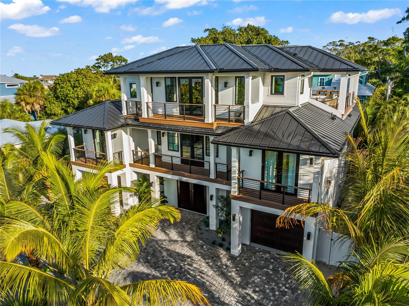 This turn-key custom built six bedroom six and a half bathroom luxury home on Anna Maria Island is an exceptional beach investment property offering the perfect balance of passive rental income and personal coastal living. Located on one of the most private and prestigious streets on Anna Maria Island just steps from beach access the home offers Gulf of Mexico views and a proven short term rental history grossing over $650,000 annually. Whether purchased as a primary residence, second home or vacation rental investment this newer construction property delivers strong returns and long term value. Designed as a high performing Anna Maria Island vacation rental and luxury coastal retreat the home features a resort style pool with in ground spa a rooftop deck with panoramic sunset and Gulf views and expansive open concept living spaces ideal for entertaining. The chefs kitchen includes top of the line appliances custom cabinetry an oversized island and formal dining area with seamless indoor outdoor living leading to multiple balconies and covered patios. The primary suite features a private balcony walk in shower and soaking tub while four additional king bedroom suites each include ensuite bathrooms. A custom bunk room adds a family friendly and rental optimized layout. Exclusive amenities include a private elevator, beach chairs and beach umbrellas enhancing both comfort and rental appeal. The backyard oasis includes a poolside lounge BBQ grill, ping pong table and multiple entertaining areas making it one of the most desirable luxury rental homes on Anna Maria Island. For added peace of mind the property includes a 10 year builder warranty and multiple transferable trade warranties offering low maintenance ownership and confidence for buyers seeking newer construction homes on Anna Maria Island. Perfectly located near Pine Avenue shopping and dining the Rod and Reel Pier the historic AMI City Pier and the free Anna Maria Island trolley this turnkey, fully furnished luxury vacation rental combines prime location strong rental income and the ultimate coastal lifestyle. This is a rare opportunity to own one of the best Anna Maria Island homes for sale and a premier Florida Gulf Coast real estate investment!