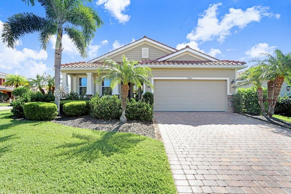 Experience refined Florida living at its finest in this extensively upgraded 2016-built residence showcasing over $93,000 in documented enhancements that elevate both lifestyle and peace of mind. A rare opportunity, this home blends luxury finishes, modern systems, and HURRICANE-RATED PROTECTION in a way that truly sets it apart. Thoughtfully crafted for both elegance and resilience, the home features 200 MPH-RATED HURRICANE PROTECTION, including an impact glass front door, automated roll-down lanai screens, and full-home accordion shutters for effortless storm readiness. A GENERATOR-READY ELECTRICAL SYSTEM, EV CHARGING CAPABILITY, and WHOLE-HOME SURGE PROTECTION deliver exceptional modern confidence and convenience.

Inside, natural light fills the open-concept layout, highlighting fresh designer paint, large-format tile flooring, and a timeless neutral palette that creates a bright atmosphere. The heart of the home is the gourmet kitchen, featuring a dramatic 10-foot island, 42-inch cabinetry, granite countertops, and stainless-steel appliances, seamlessly flowing into expansive living and dining areas ideal for both entertaining and everyday comfort. The primary suite offers a true private retreat with custom California Closets, upgraded luxury vinyl plank flooring, and a spa-inspired bath that feels like a daily escape.

Step outside and experience resort-style Florida living with a screened lanai surrounding a HEATED POOL, along with an energy-efficient heat pump, upgraded filtration system, and a generous covered seating area for year-round enjoyment and relaxation. Additional improvements include a WHOLE-HOME WATER FILTRATION SYSTEM, HD SECURITY SYSTEM, and a collection of thoughtfully curated upgrades throughout, including an epoxy-finished garage, plantation shutters, seamless gutters, and a professionally engineered drainage system, reflecting meticulous care and long-term pride of ownership.

Located in the highly desirable gated community of Soleil, residents enjoy resort-style amenities including a pool, bocce ball courts, dog park, picnic pavilion, and clubhouse with a 24-hour fitness center, full kitchen, game room, locker rooms, and social spaces. HOA fees are remarkably low at just $93 a month. Ideally positioned with a Sarasota address in Manatee County, this home is less than 10 minutes from Sarasota Bradenton International Airport and offers favorable property tax advantages.

This home represents a rare opportunity to secure a fully upgraded, move-in-ready Florida residence offering luxury, security, and effortless living in one complete package.