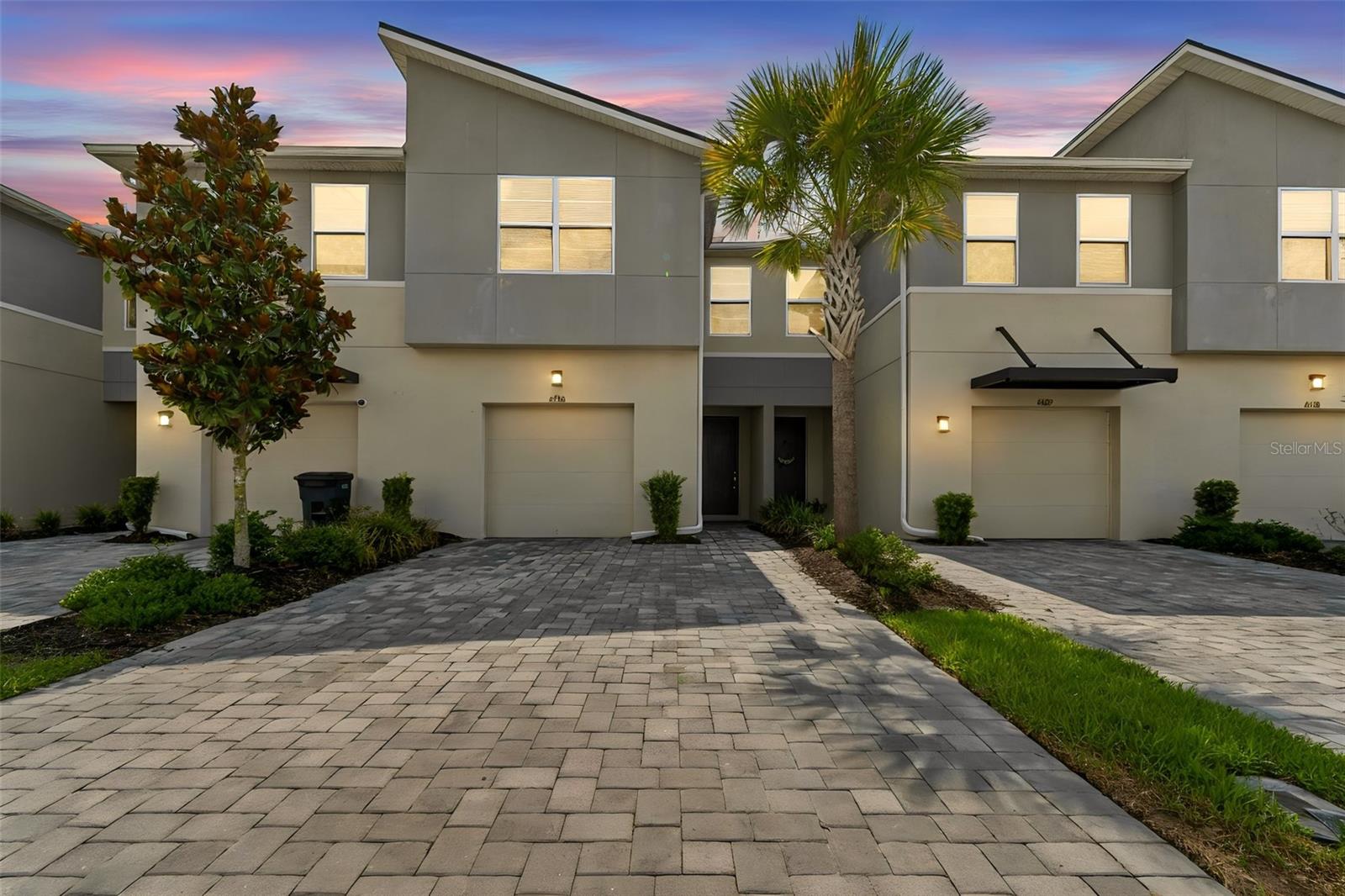 A Stunning and very contemporary Mattamy townhome in the perfect location has arrived. This 1888 sq ft home is modern and fresh and competitively priced. Volanti is a gated community located in Lutz, FL. Zoned for A-rated schools, this home is surrounded by upscale shopping, restaurants, grocery, medical, and an easy travel to Tampa International Airport. Exterior maintenance is included. With modern colors and design trends throughout, this 3 bedroom, 2.5 bathroom, 1 car garage offers an open floor plan and is cozy. Driveway is extended to fit 2 cars and there is TESLA charger in garage. Once inside, take note of the open feeling. The kitchen is upscale with stainless steel appliances, tons of counter top space, center island, and ample storage. Upgraded lighting throughout. The island provides additional seating. Spacious living room and great outside PRIVATE views. You have a screened in patio for enjoyment.  1/2 bath tucked away on main level. Upstairs you have a primary suite with walk in closet, an ensuite with dual sinks and tiled shower. The other two rooms are just as spacious and share a common full bathroom. Laundry upstairs with storage. The clubhouse is amazing with community pool, fire pit area, a park, a playground, and more. Location, price, and move-in condition makes this townhome full of VALUE!