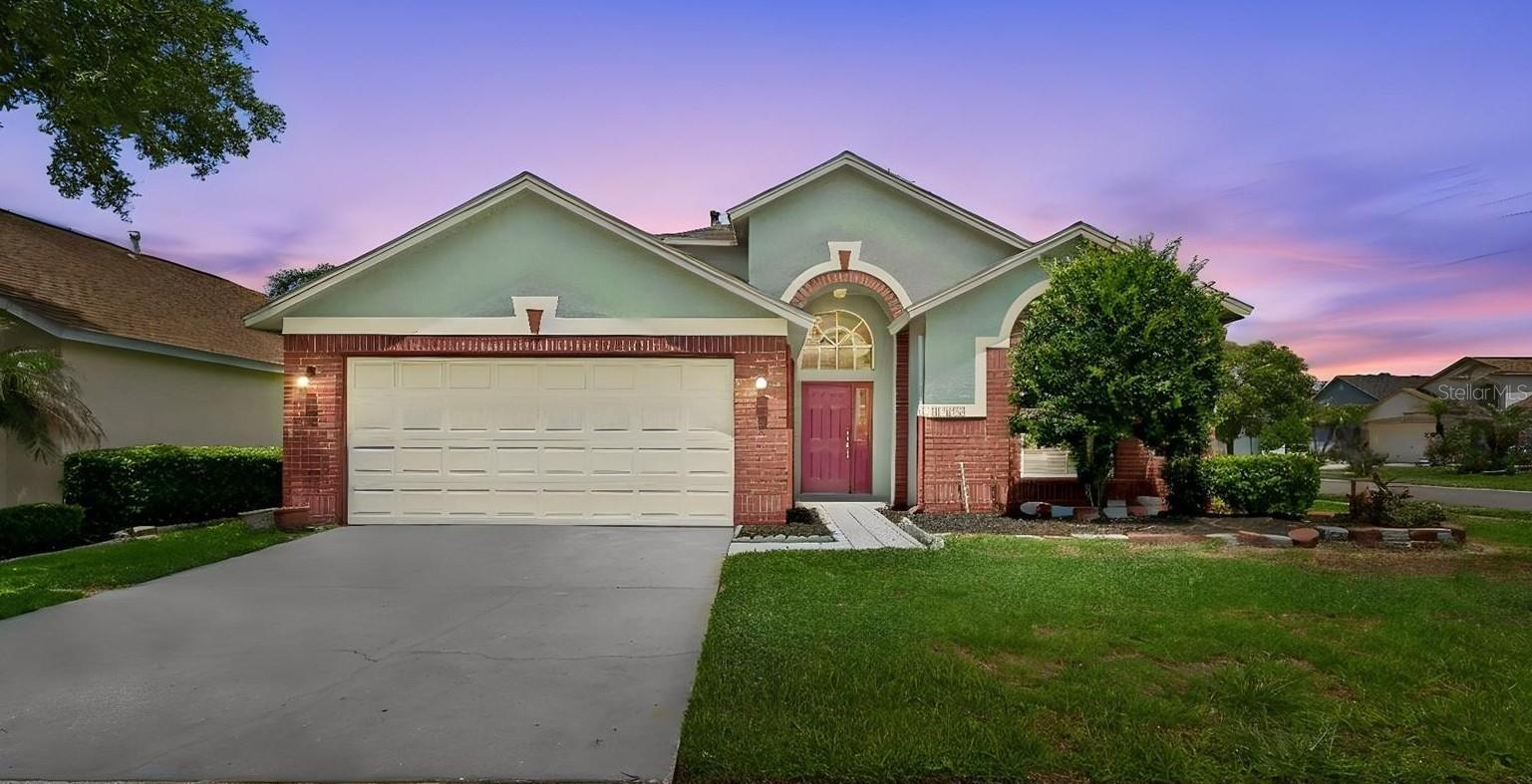 Wrencrest Village in Meadow Pointe II — Move-in ready - Gated - One Story - Corner lot - Pond Views - Roof 2021! This 3 bedroom / 2 bath home welcomes you with vaulted ceilings and a lot of natural light, creating a larger than life bright and open atmosphere the moment you walk in. The beautiful neutral ceramic tile flooring adds both style and durability, making it easy to maintain while enhancing the home’s modern look. The kitchen is designed for real life and entertaining alike, featuring Breakfast Bar open to the Living & Dining Areas, Granite countertops, a built-in desk, breakfast nook with chair rail molding which elevates the space and features a custom Window bench that’s perfect for morning coffee, working from home, or unwinding with your favorite book. The split-bedroom floor plan offers privacy and flexibility. The Oversized primary suite is a true retreat with an extra-large walk-in closet, dual vanities, garden tub, separate shower, and generous counter space. Step outside to your covered and screened patio overlooking the pond — an ideal backdrop for weekend BBQs, relaxing evenings, and gatherings with family and friends. One of this home's most Valuable features is its unbeatable location near education. Enjoy the convenience of being short distance to one of Wesley Chapel's most sought-after school zones. Elementary, middle, and high schools are all located approximately one mile of the home, creating an easy daily routine. Even Pasco-Hernando State College is nearby, making this an exceptional location for families planning for every stage of education. Living in Meadow Pointe II means access to Resort-style amenities including pools, tennis courts, fitness center, playgrounds, and miles of walking, jogging, and biking trails. Plus, you’re minutes from Wiregrass Mall, Tampa Premium Outlets, Publix, coffee shops, dining, top-rated schools, Advent Health, the new Orlando Health campus under construction, and the upcoming Whole Foods. Quick access to I-75 puts downtown Tampa about 30 minutes away and Gulf beaches within easy reach. Homes in this location and price point do not last long — especially move-in ready homes with pond views in a gated community. Don't miss out! Contact us for a showing.