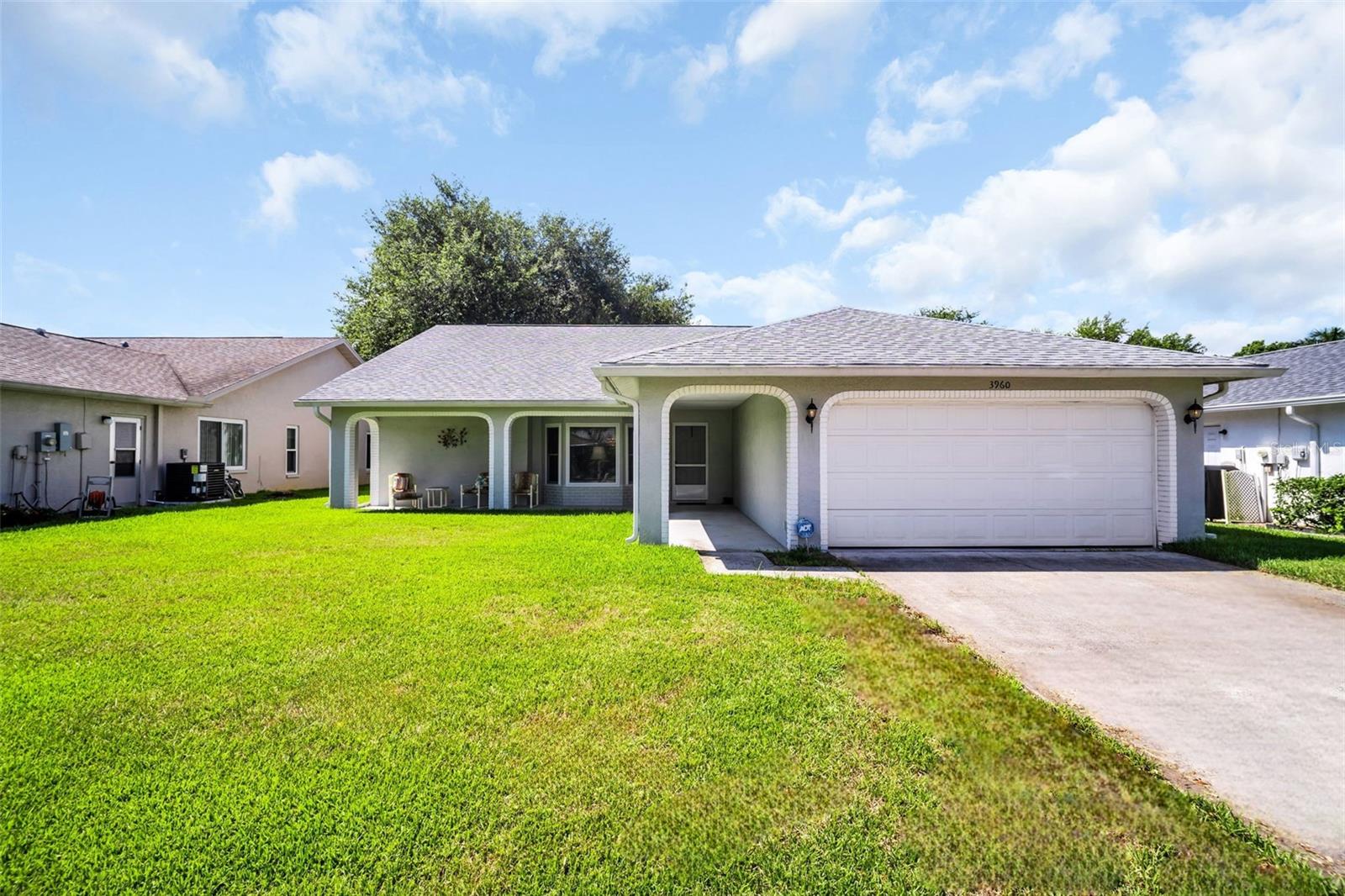 Perfectly positioned in one of the most desirable locations within Highland Lakes, Palm Harbor's premier 55+ golf community, this beautiful 3-bedroom, 2-bath home plus a bonus fully enclosed lanai offers an exceptional combination of modern upgrades, spacious living, and an unbeatable lifestyle. Just steps from the community's Lake Tarpon Lodge, this inviting residence features a sought-after split-bedroom floor plan with soaring vaulted ceilings in both the living and family rooms, creating a bright, open atmosphere filled with natural light. Luxury vinyl plank flooring extends throughout the home, complemented by updated hurricane-impact windows, a spacious indoor laundry room, and an attached two-car garage. At the center of the home, the beautifully renovated kitchen has been thoughtfully redesigned for both everyday living and entertaining. Featuring granite countertops, updated soft-close cabinetry, a charming breakfast nook, and a newly opened kitchen to the living room with bar-top seating, it seamlessly connects the home's main living spaces. Three sliders out to the fully enclosed lanai with new windows provides a comfortable year-round retreat, offering valuable additional living space that's not included in the heated square footage of the home! MAJOR UPDATES include a NEW 2024 HVAC, NEW 2024 hot water heater, NEW 2020 ROOF, updated hurricane-impact windows, and a cost-saving deep well for irrigation! No insurance worries here with a recently passed 4-point inspection and located safely high and dry in a non-flood zone. Highland Lakes offers one of the finest active adult lifestyles in the Tampa Bay area with an incredibly affordable HOA fee of only $164 per month. Residents enjoy unlimited FREE golf on three private executive golf courses, tennis, pickleball, bocce, shuffleboard, and a vibrant clubhouse featuring fitness classes, entertainment, clubs, and year-round social activities. The private Lake Tarpon Lodge offers a boat ramp, fishing pier, and community pontoon boats, while complimentary RV and boat storage and golf cart-friendly streets make everyday living even more convenient. Located just minutes from award-winning Gulf beaches, premier shopping and dining, top-rated healthcare, professional sports venues, two international airports, and a cruise port, this move-in-ready home offers the perfect opportunity to enjoy the very best of Florida living. Call today and experience everything this exceptional home and community have to offer!