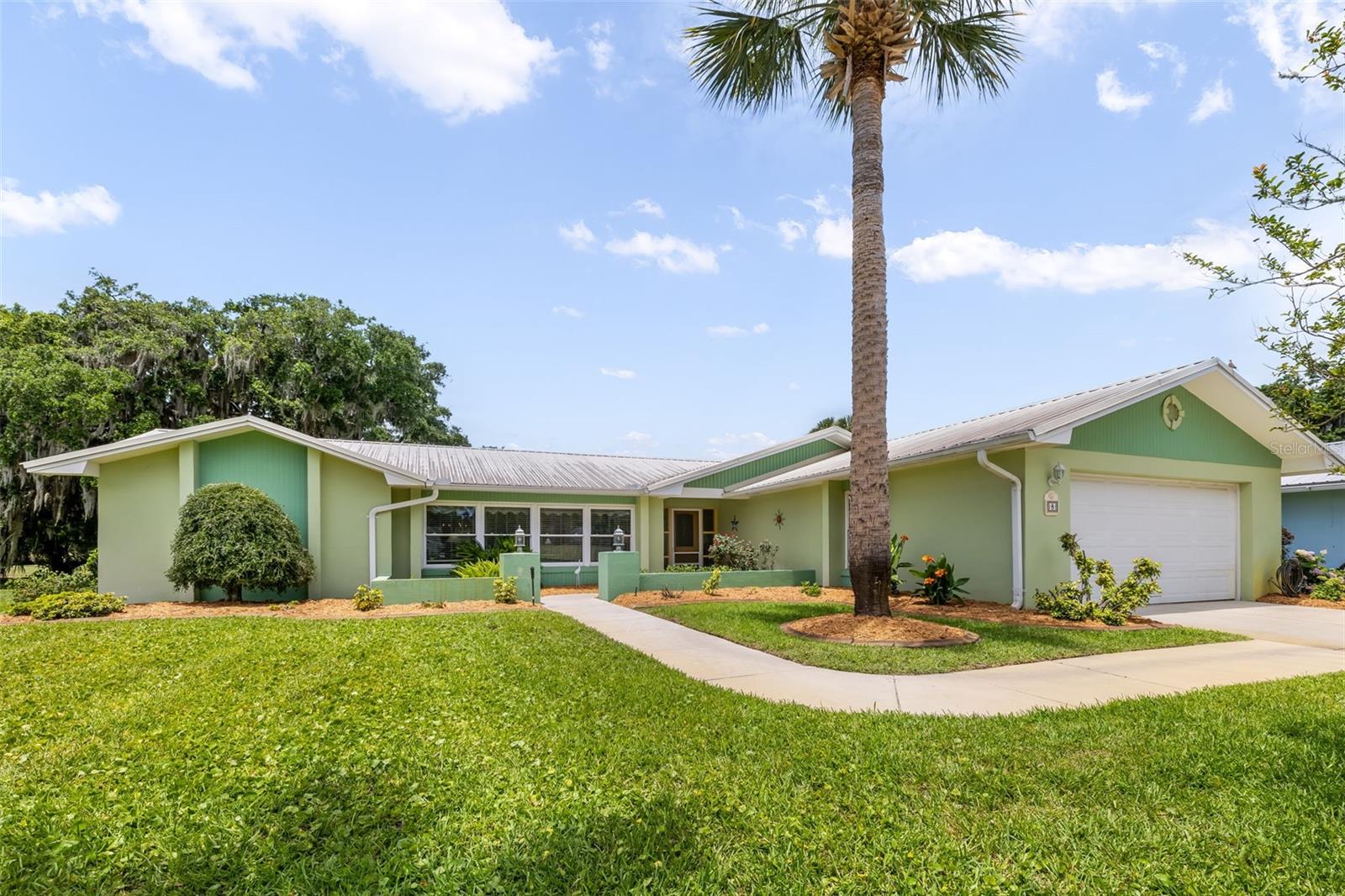 Set directly on the Palm Harbor Golf Club course, this 3-bedroom, 2-bath home offers over 1,900 square feet of comfortable, updated living with serene fairway views as your daily backdrop. Located near the end of a quiet cul-de-sac on Courtney Place, the property enjoys minimal through-traffic and a peaceful, tucked-away feel that is hard to find. Manicured neighboring homes and a history of limited turnover on the street give this block a true “homes rarely for sale” appeal.

Inside, the spacious single-story layout features beautifully updated flooring that flows through the living areas, creating a warm, cohesive look that highlights the natural light and golf-course vistas. Large bedrooms—bigger than you typically see in newer construction—offer plenty of room to spread out, work, or unwind in private comfort. The backyard has beautiful landscaping with fruit trees and a large florida room! 

All of this comes in a prime Palm Coast location: a quiet, beautifully maintained street right on the course, yet still convenient to Colbert Lane, I-95, shopping, dining, and the beach. If you have been waiting for a rare opportunity on Courtney Place, this is the one
