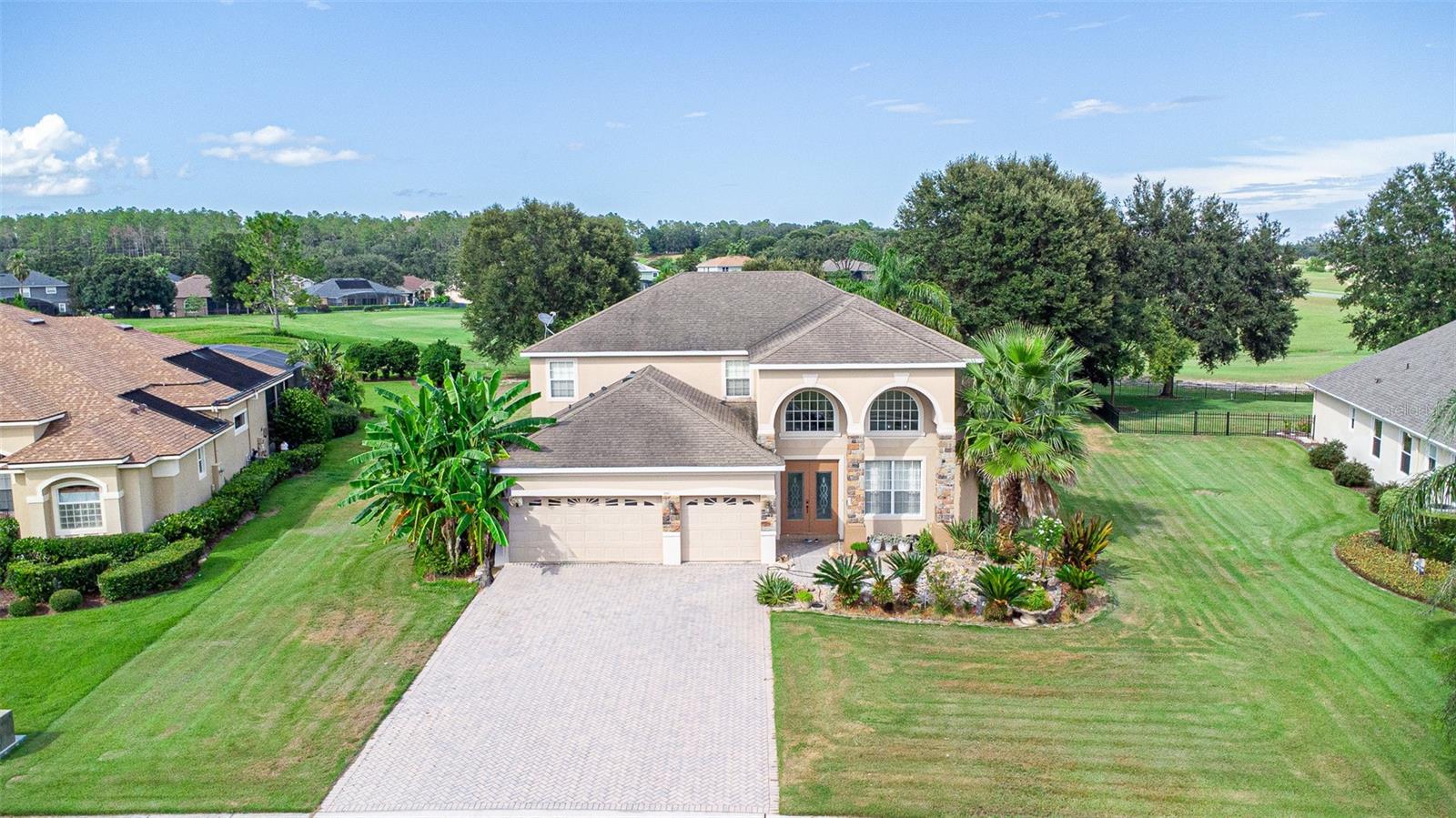Welcome to this beautifully maintained home in the sought-after Sorrento Springs golf community in Sorrento, Florida—just about 35 minutes north of Downtown Orlando. This spacious two-story residence offers 4 bedrooms plus a large upstairs bonus/game room (easily used as a 5th or 6th room), 3.5 bathrooms, and a 3-car garage.
Designed for both comfort and entertaining, the home features an open floor plan with high ceilings, abundant natural light, and seamless flow between living spaces. The gourmet kitchen includes a center island, ample counter space, and overlooks the family room with views of the backyard and covered patio.
The expansive upstairs game room (approx. 15’ x 18’) offers flexible space for a media room, home gym, or additional living area. The luxurious downstairs primary suite features dual walk-in closets, separate vanities, a soaking tub, and a serene sitting area.
Situated on a cul-de-sac lot within a golf course community, residents enjoy sidewalks, a community pool, and a peaceful neighborhood setting.
Don’t miss this opportunity—schedule your private showing today