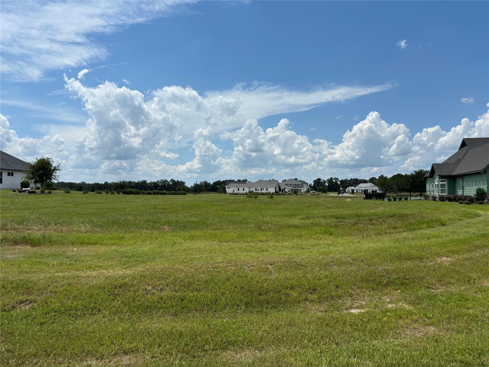 This is great opportunity to design and build a new Jeffrey M Wilde Builder home on a 1 acre lot in a gated neighborhood.  The neighborhood is centered around walking trails, gardens, orchards and a conservation preserve.  Owners have access to an event barn and a farmhouse.  With lots of green space, this is a unique neighborhood in SW Gainesville.  Close to schools, shopping, and the University, you can live in a quiet and private neighborhood located minutes from everything.