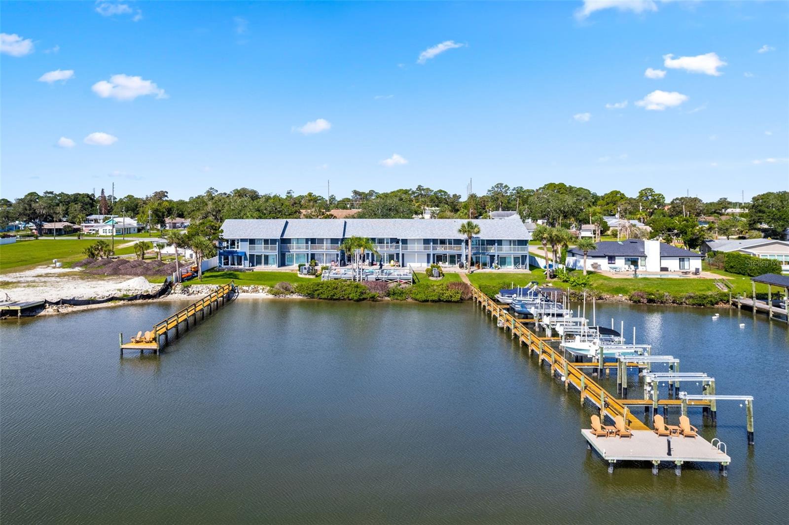 Wake up to sparkling river views and end your day with some of the best fishing right outside your door. This fully furnished 2-bedroom, 2.5-bath riverfront retreat offers the perfect blend of relaxation and convenience, complete with river access, a private 1-car garage, and brand new hurricane windows and sliding doors. Inside, you'll find an open-concept layout designed for easy living, featuring tile and laminate flooring, a spacious living and dining combination, and an eat-in kitchen that keeps everyone connected. Whether you're searching for a weekend escape, seasonal getaway, or full-time waterfront lifestyle, this move-in-ready gem checks all the boxes. Enjoy morning coffee overlooking the water, spend afternoons casting a line, and embrace the laid-back Florida lifestyle you've been dreaming about. Furniture is included, making your transition effortless. Waterfront living, river access, and unforgettable views await.