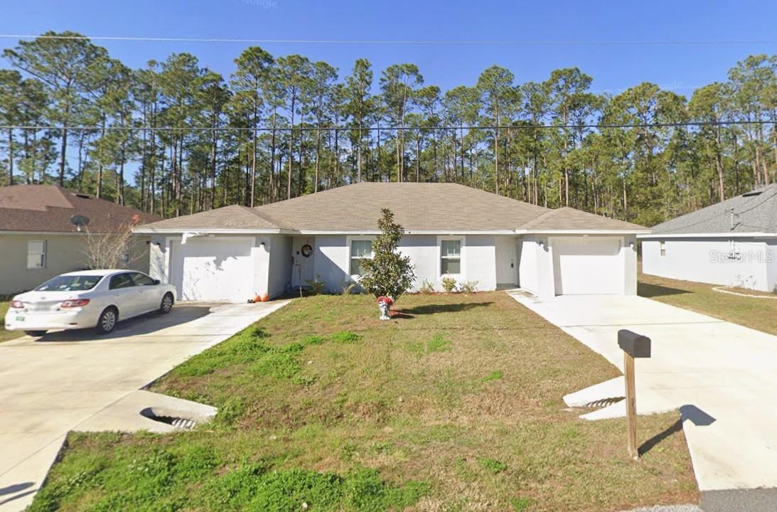 Virtually Staged. Two, 2-bedroom, 2-bathroom units, each with a 1-car garage, in the heart of Palm Coast. No HOA. Backing to a wooded area, the property offers natural privacy and a peaceful setting.

Each unit features a bright, open-concept floor plan designed for comfortable living and entertaining. Luxury vinyl plank flooring runs throughout, combining durability with easy maintenance. Spacious living and dining areas are filled with natural light, creating a warm and inviting atmosphere.

The kitchens feature granite countertops, breakfast bars, stainless steel appliances, ample cabinet space, and contemporary finishes. Both bedrooms are generously sized, while the full bathrooms have modern fixtures and functional layouts. Washer and dryer connections are included for added convenience.

Whether you're building your investment portfolio or looking to offset your mortgage with rental income, this duplex offers flexibility, modern finishes, and an excellent Palm Coast location.