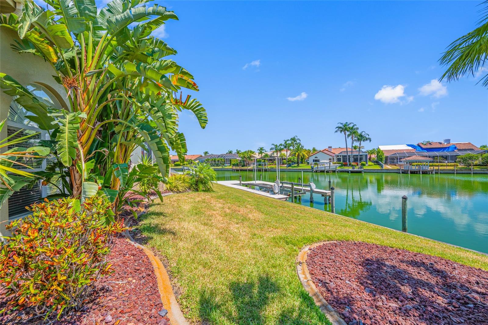 BEAUTIFULLY RENOVATED WATERFRONT HOME WITH BAY & GULF ACCESS in the heart of Tampa!  Don't miss this opportunity to own a fabulous home situated on a spacious corner lot in the highly desirable gated Bayside community. This home offers the perfect blend of luxury, casual elegance and peace of mind. NEWER TILE ROOF (2023) and NEW HVAC SYSTEM (2023) provide valuable peace of mind for years to come! Step inside to discover an OPEN FLOOR PLAN with HIGH CEILINGS and crown molding throughout the formal living and dining areas, with updated light fixtures, and GORGEOUS PORCELAIN TILE FLOORING. Just off the living room is a SEPARATE BONUS ROOM that could be used as an office, 5th bedroom or fitness room. Culinary enthusiasts will be inspired in the spectacular RENOVATED KITCHEN designed for both everyday living and entertaining. One of the biggest kitchen highlights is the 6 BURNER WOLF GAS RANGE with a stainless steel hood and grilling surface, valued at 17K! Along with massive counter space, tons of cabinets, APRON SINK, pull out drawers, and STUNNING QUARTZ COUNTERTOPS, this kitchen is sure to please! Not to mention the breakfast bar and separate nook for more casual dining. The kitchen overlooks the huge family room that has a beautiful FIREPLACE as it’s centerpiece with built in shelving. Also a large BUILT IN WET BAR to match the kitchen, with great counter space for snacks, a WINE REFRIGERATOR, and lots of storage for games/books, just perfect for entertaining or hanging out with the family. Beyond the family room are 3 spacious bedrooms with 2 RENOVATED POOL BATHS, with one serving as a POOL BATH as well. Both have LIGHTED MAKE UP MIRRORS, walk in showers, and quartz countertops. With this SPLIT FLOOR PLAN, the spacious primary suite is on the other side of the home and serves as a PRIVATE RETREAT WITH ITS OWN ATTACHED DEN - ideal for a nursery, home office, or private sitting area. Additional highlights include French doors going out to the pool and a spacious ensuite bathroom with a CLAW FOOT TUB, walk in shower and double vanities and private water closet. Outdoor living shines with a screened lanai overlooking the sparkling PebbleTec finished pool & spill over spa, along with tranquil WIDE CANAL VIEWS. Bring on the pool parties, with easy grilling in the outdoor kitchen, equipped with a stainless steel grill and smoker. Also bar seating with granite countertops for chatting with the grill master! Enjoy morning coffee, or sunset libations, while taking in the water views! The private dock features COMPOSITE DECKING & BOAT LIFT, providing access from the canal via a community boat lift to the open waters of Tampa Bay and the Gulf beyond. THE SIDE LOAD 3 CAR GARAGE IS OVERSIZED with lots of storage cabinets and equipped with 2 ELECTRIC CHARGING STATIONS. Boating enthusiasts will appreciate the direct access, along with the VIBRANT WATERFRONT LIFESTYLE that the Villages of Bayport/Bayside has to offer. Residents may also enjoy membership in the Bayport Yacht Club, offering neighborhood social events and waterfront camaraderie for a modest annual fee of $150. Great location, 15 mins to the airport and conveniently located approximately 3 miles to Berkeley Preparatory School, 15 mins to International Mall and 30 mins to Clearwater Beach. Restaurants, shopping, golfing, parks and recreation are all nearby. COME AND SEE WHAT A GREAT PLACE THIS WOULD BE TO DROP YOUR ANCHOR AND CALL HOME! Be sure & watch the video! Room sizes are estimated