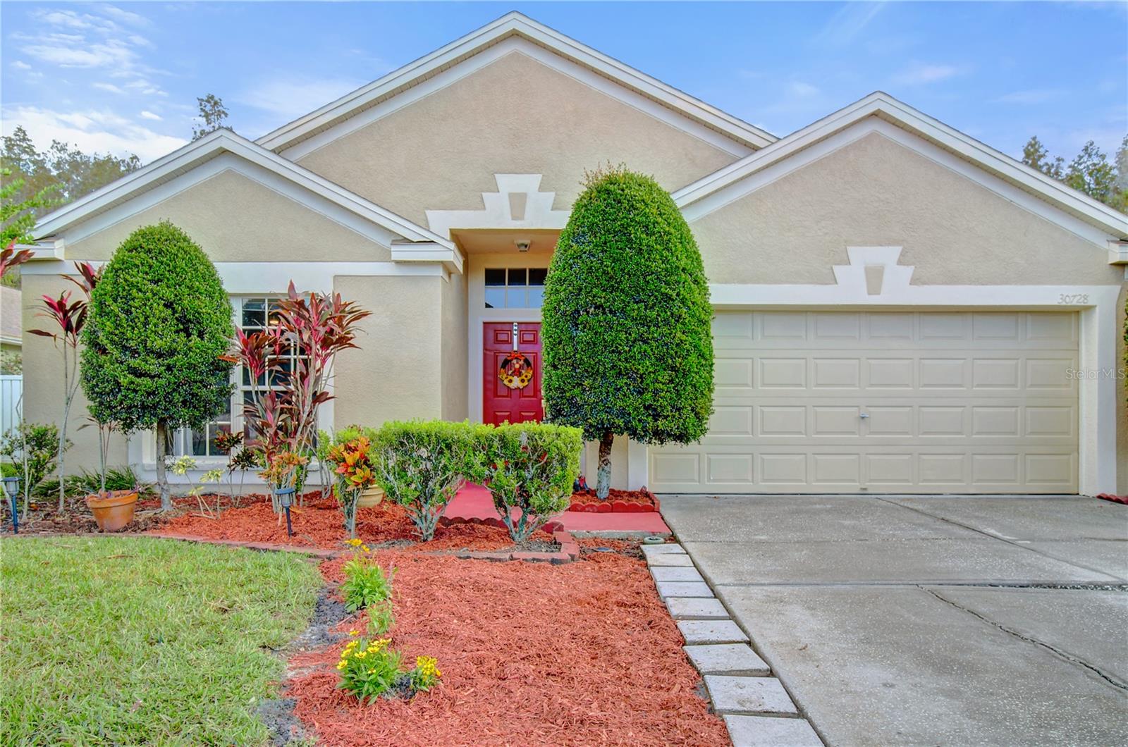 Welcome home to Meadow Pointe II a wonderfully planned out community that offers many amenities for the entire family with no HOA only CDD. From fitness centers, swimming pools, tennis, volleyball and basketball courts this neighborhood has it all. There is a reason why Wesley Chapel, Fl is one of the fastest growing cities in the U.S, it's conveniently located off of I-275 and State Rd 56. It is also a short commute to downtown Tampa. Wesley Chapel offers an abundance of dining options and local shopping as well. This is an incredible opportunity to purchase a move in ready, freshly renovated home. No need to worry about updates, the owners did a fabulous job repainting, replacing appliances and remodeling the guest bathroom. This wonderful home features 3 bedrooms, 2 bathrooms and the back patio has been enclosed and would make a lovely office or playroom. The home features laminate flooring throughout living room, dining room and bedrooms. The kitchen features an eat in nook and stainless appliances.  The washer and dryer hookups and hot water heater are in the garage.  Motivated seller! Please make an appointment to see this lovely home today.