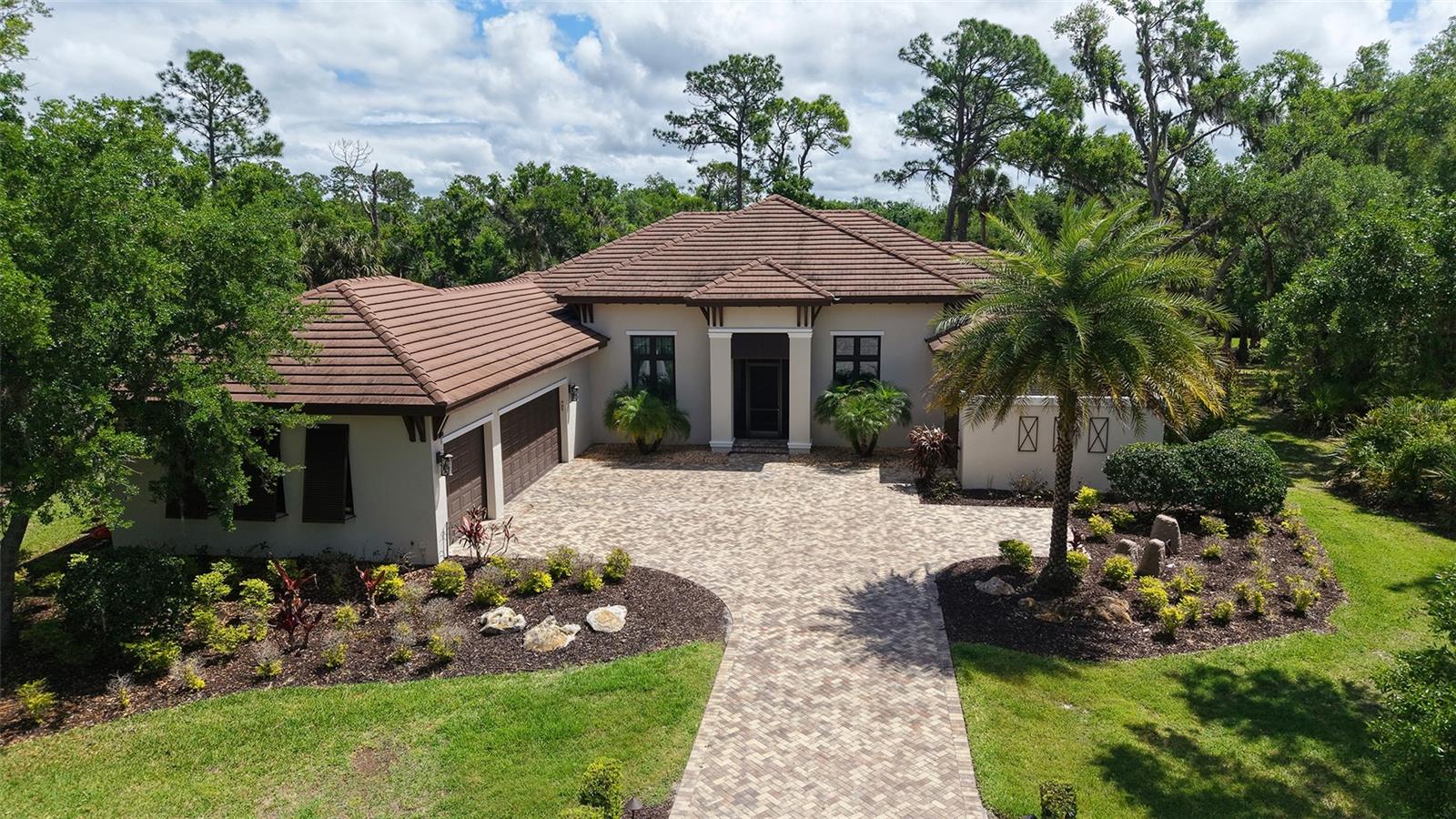 Tucked away on a quiet, oversized 3 Acre homesite in The Forest at Hi Hat Ranch, this 2021-built estate offers the kind of space and privacy that is becoming increasingly hard to find. It’s a home designed for those who want a true connection to nature without sacrificing a bit of modern comfort or high-end style.

Inside, the 4,200 square feet feels remarkably easy to live in. The main living areas are bathed in natural light, featuring soaring ceilings and warm wood accents that add character to the contemporary design. The chef’s kitchen flows seamlessly into the dining and great room, creating a perfect hub for hosting friends or just enjoying a quiet morning at home. The primary suite serves as a true main-level retreat, while the rest of the home offers total flexibility—whether you need a dedicated home office, a fitness space, or room for a growing family.

The backyard is where the property really distinguishes itself. The screened-in pool and spa area feels like a private sanctuary, overlooking a peaceful pond and a lush, natural landscape of mature trees. Just beyond the pool, you’ll find one of the most unique features in Sarasota: a custom-built treehouse tucked into the woods. It’s an incredible creative escape or a one-of-a-kind play space that you won't find anywhere else.

Living in Hi Hat Ranch gives you that secluded "estate" feel, yet you’re still just a short drive from the shopping and dining at Lakewood Ranch, the vibrant scene at Waterside, and the world-class beaches of Sarasota. This isn't just a house; it’s a place to slow down, spread out, and actually enjoy the Florida lifestyle.