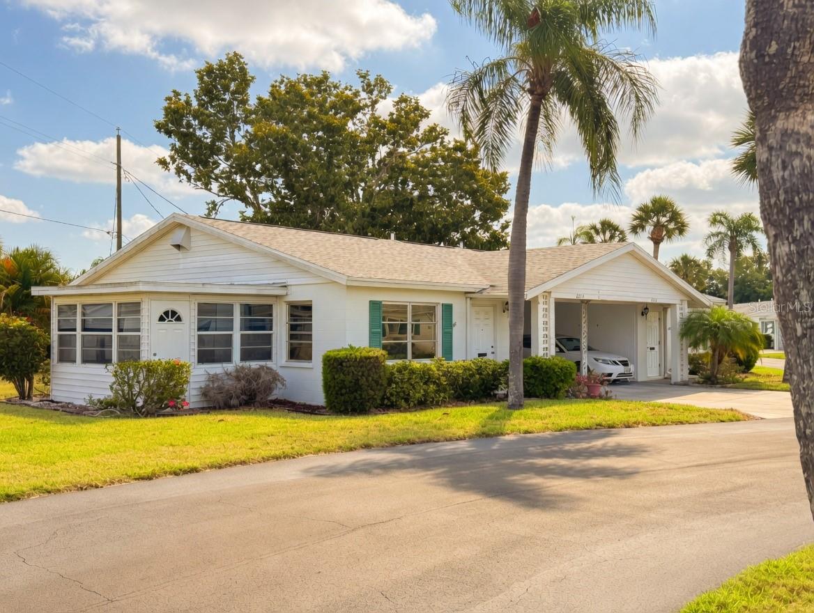 MAINTENANCE-FREE LIVING IN THIS CHARMING VILLA! This 2-bedroom, 2-bath villa offers the perfect blend of comfort, convenience, and Florida lifestyle at an incredible value, ideal for snowbirds, retirees, or anyone seeking low-maintenance living in a friendly, active community.
Step inside to bright interiors with living and dining areas that flow seamlessly for easy entertaining or quiet nights at home. Both bedrooms have ample closet space (including mirrored doors in one), while the baths offer convenience—one with a relaxing tub and the other featuring a walk-in shower. Additional highlights include an enclosed lanai/sunroom perfect for year-round enjoyment with views of the lush grounds, a laundry room with washer and dryer accessed from the carport, and ceiling fans throughout. You’ll love preparing meals in this sunny kitchen that captures wonderful bay breezes from the side door. With everything right at your fingertips, cooking feels effortless in the cozy layout.
Residents of Parkway Villas enjoy fantastic resort-style amenities right outside your door: a sparkling heated community pool for hours of relaxation, exercise, or friendly conversation with neighbors. Enjoy shuffleboard courts, a clubhouse with billiards/pool table, and beautifully landscaped common areas—truly maintenance-free living at its finest!
You’re just minutes from the pristine beaches of Anna Maria Island, where you can stroll sandy shores, enjoy gentle Gulf breezes, and watch spectacular sunsets nightly. Convenient to shopping, dining, parks, hospitals, GT Bray Park, and easy access to everything Florida’s Gulf Coast has to offer.
This is YOUR PIECE OF PARADISE!!! Priced to sell and ready for its next chapter—don’t miss out on this gem. Call today for a private showing and start enjoying the Florida lifestyle you deserve!